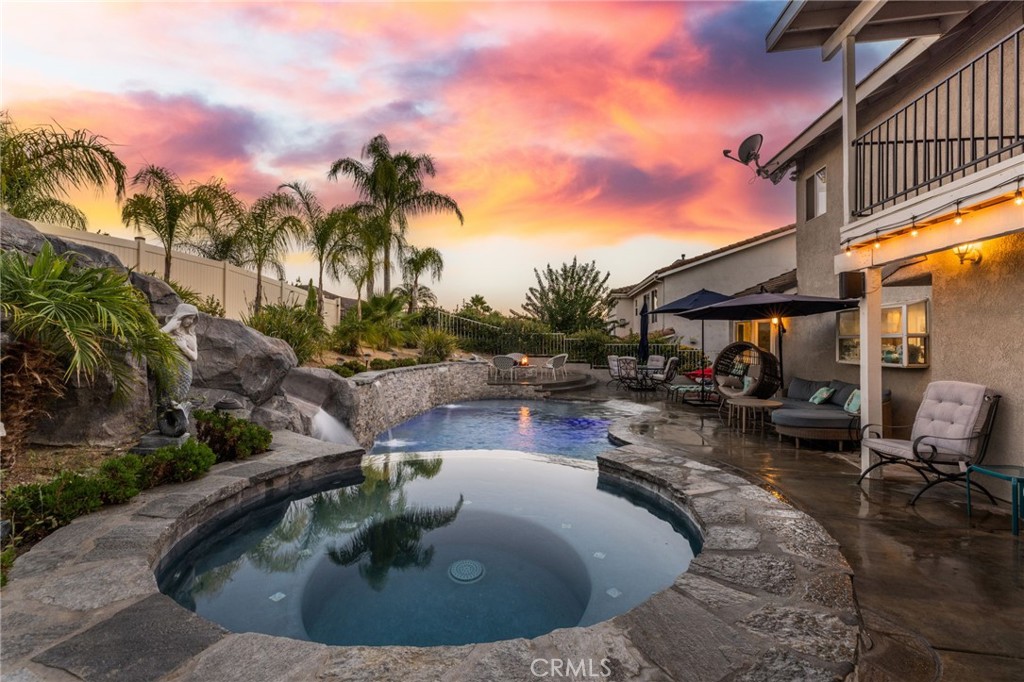 Welcome to the ultimate Canyon Lake lifestyle! Nestled on one of the most desirable streets in the community and just minutes from the East Gate, this 3-bedroom, 3-bath POOL home is the perfect mix of charm, comfort, and full-on fun. From the moment you step onto the cozy front porch and take in the manicured yard, you’ll feel right at home. Inside, the vibe is equally inviting — the formal living room is bright and spacious with natural light pouring through the oversized windows, while the fireplace and built-in window seat create the perfect spot to curl up with a book or sip your morning coffee. Hosting dinner parties or holidays? The formal dining room is ready to impress. The kitchen is a total win — featuring stainless steel appliances, a breakfast bar, and tons of cabinet space to store all your goodies. It flows effortlessly into the dining area, making it perfect for everyday life or entertaining guests. Upstairs, you’ll find three generous bedrooms including a dreamy primary suite with its own private balcony overlooking your personal backyard paradise and views of the lake! It also includes an en-suite bath, walk-in closet and a bonus second closet for all your storage needs. Now let’s talk about the real showstopper: the backyard! Say hello to your brand-new tropical rock pool, complete with a beach entry, two cascading waterfalls, and an epic slide that’ll make you the most popular host in town. With desert-friendly landscaping and direct access to the waterfront easement, this backyard is all about max relaxation with minimum upkeep. Whether you're taking a dip in the pool, launching your paddleboard at the lake just steps from your gate, or enjoying the peace and privacy of your outdoor oasis — this home is all about living your best Canyon Lake life. All of this located within Canyon Lake, a private, gated community with 24/7 security and unmatched amenities, including a 384-acre waterski/fishing lake, 20+ parks with beaches and playgrounds, basketball and baseball courts, tennis and pickleball, an equestrian center, an 18-hole golf course, dog park, community pool, restaurants, slalom course, ski jump, golf cart-friendly streets, and year-round events for the whole family!