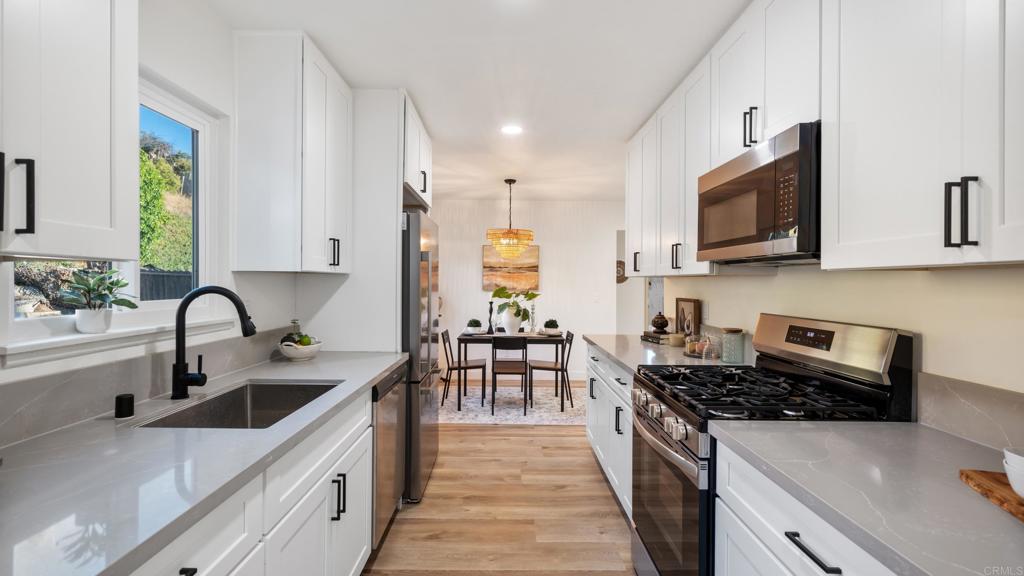 Welcome to a beautifully renovated and move-in ready ranch-style home in San Diego’s Skyline neighborhood. This 1,156 sqft residence boasts 3 bedrooms and 2 full baths, upgraded kitchen and dual-pane windows that flood the interior with natural light. The open plan flows effortlessly from the living area to a covered rear patio and extends to a spacious backyard, perfect for outdoor living or future landscaping. Additional features include a 2-car attached garage, indoor laundry, and charming hillside views. Located just 20 minutes from downtown, with easy access to freeways, schools, parks, and shopping, this turnkey home blends convenience and modern comfort in a neighborhood on the rise!