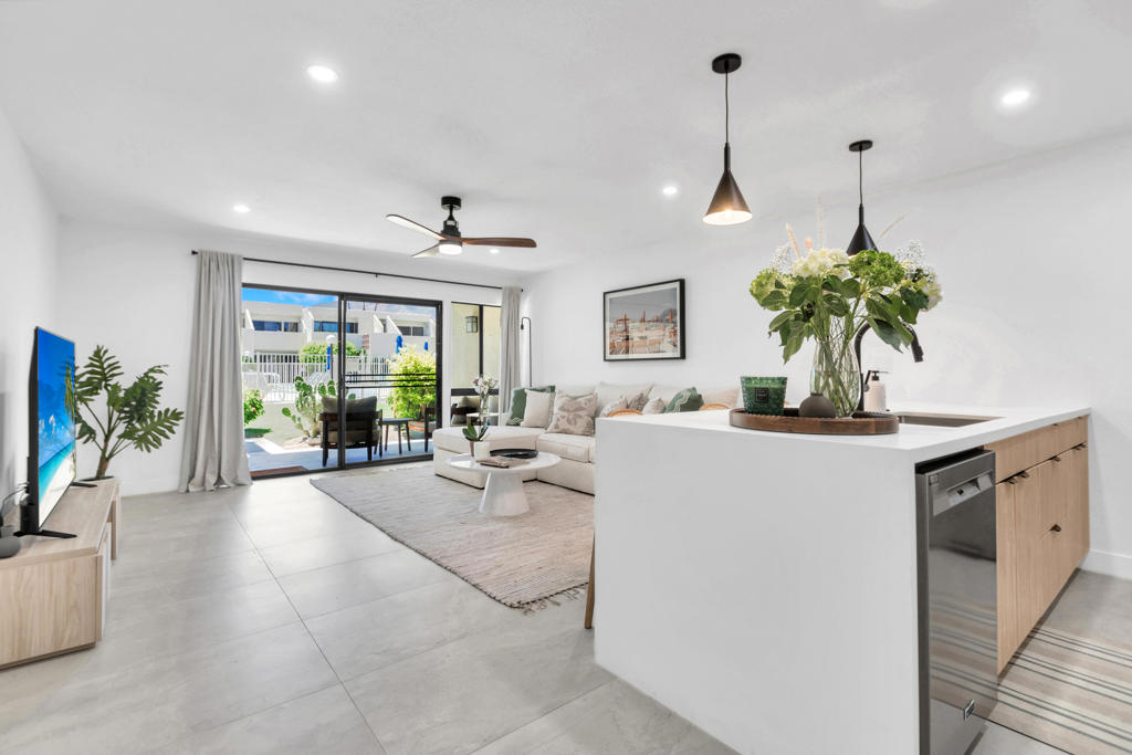 Completely remodeled 1-Bed/1-Bath Condo in the iconic Smoke Tree Racquet Club in South Palm Springs. This ground-level corner unit features a sleek open floor plan with 24x48' porcelain tile throughout. The brand-new chef's kitchen includes custom European cabinetry, white quartz counters, a waterfall island, and Maytag stainless steel appliances--perfect for cooking and entertaining. The spacious bedroom offers an in-closet washer/dryer hookup and ceiling fan. The updated bathroom includes a porcelain and marble tiled shower, European vanity, and modern fixtures. New recessed lighting and fresh paint add to the clean, contemporary look. Enjoy stunning sunset views from your private patio. The community offers resort-style amenities including a pool, spa, and 4 tennis/pickleball courts with mountain views. Conveniently located across from the SmokeTree shopping center (Ralph's, Starbucks, Native Foods, more) and just minutes from downtown Palm Springs. With a low HOA and land lease through 2067, this condo is ideal as a first home, second home, or investment property. This is a must-see unit--designer finishes, modern lighting, and smart layout set it apart from the rest. All furnishings are available outside of escrow. Schedule your showing today!