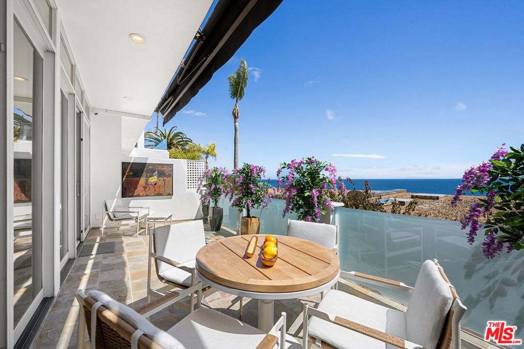 Beautiful bluff two-story Richard Neutra designed living space overlooking Escondido Beach. Enjoy panoramic ocean views from two of three balcony areas. Upstairs primary boasts a walk-in closet and covered balcony while the 2nd bedroom could be used as an additional office with its balcony. Enjoy the water and sun from this mid-century inspired condominium in the private and secluded Holiday House. With a private path to Geoffrey's and the beach, what else do you need? Offered furnished or unfurnished. Lease amount for summer/short term to be $22,000/Month.