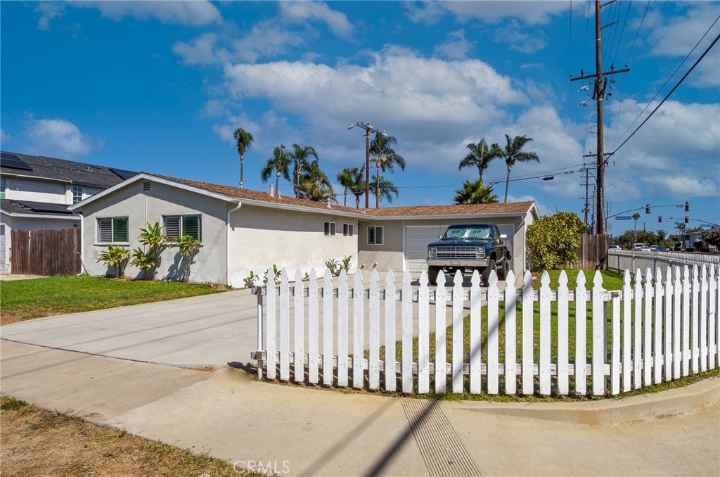 Welcome to 2252 Federal Avenue, your coastal retreat in the heart of Costa Mesa! Nestled in one of Orange County’s most desirable neighborhoods, this beautifully single-story home blends beach-town living with modern comfort and convenience. Offering three spacious bedrooms and two stylishly updated bathrooms, this residence is move-in ready and designed for effortless California living. Step inside to discover a light-filled open floor plan enhanced with new flooring, bathroom tile, and carpet. The upgraded kitchen features custom wood cabinetry, quartz countertops, and stainless-steel appliances, creating an inviting space for home-cooked meals and entertaining. Both bathrooms have been tastefully renovated with designer tile, new vanities, and contemporary fixtures. The extended driveway offers ample parking for guests, while the attached two-car garage provides convenience and storage. Located just minutes from Newport and Huntington Beaches, residents enjoy the coastal lifestyle without the coastal price. Outdoor enthusiasts will appreciate being just blocks from Fairview Park, the Santa Ana River Trail, and a network of scenic hiking and biking paths that lead directly to the ocean. Families will appreciate the proximity to top-rated Newport-Mesa Unified schools, including Davis Magnet, Costa Mesa Middle School, and Costa Mesa High School. Commuters will find easy access to the 55, 405, and Pacific Coast Highway, making travel north toward Los Angeles or south toward Laguna Beach a breeze. You’re also just minutes from premier shopping and dining destinations such as South Coast Plaza, Fashion Island, and 17th Street’s local cafes and boutiques. Whether you’re looking to plant roots, raise a family, or enjoy the best of coastal Orange County living, 2252 Federal Avenue offers the perfect blend of style, location, and lifestyle. Don’t miss your opportunity to call this stunning home your own — schedule your private tour today!