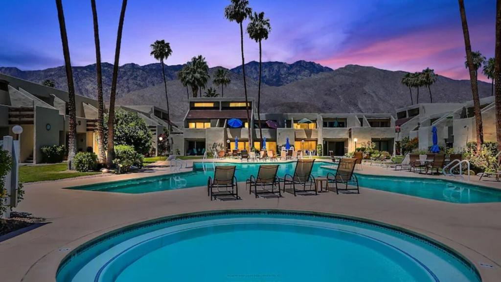 Thirty-day rentals allowed! Welcome to your private home, second home or a Investment property! This condo is already a successful vacation rental. This AMAZING VIEWS furnished/turnkey 1-bedroom, 1-bath condo offers stunning mountain views in the highly desirable South Palm Springs area. As an end unit, it features an additional window that floods the space with natural light. The updated open-concept kitchen overlooks the spacious living and dining areas. The generously sized bedroom and bath include soft-close cabinetry and modern finishes. Enjoy your private balcony, which provides secure access to a shortcut leading directly to the pool, clubhouse, walking trails or laundry. Experience the beautiful grounds of Smoke Tree Racquet Club, including lighted tennis courts, a pickleball court, bike storage, a dog park, covered parking(carport), community laundry rooms, and a sparkling pool and spa.