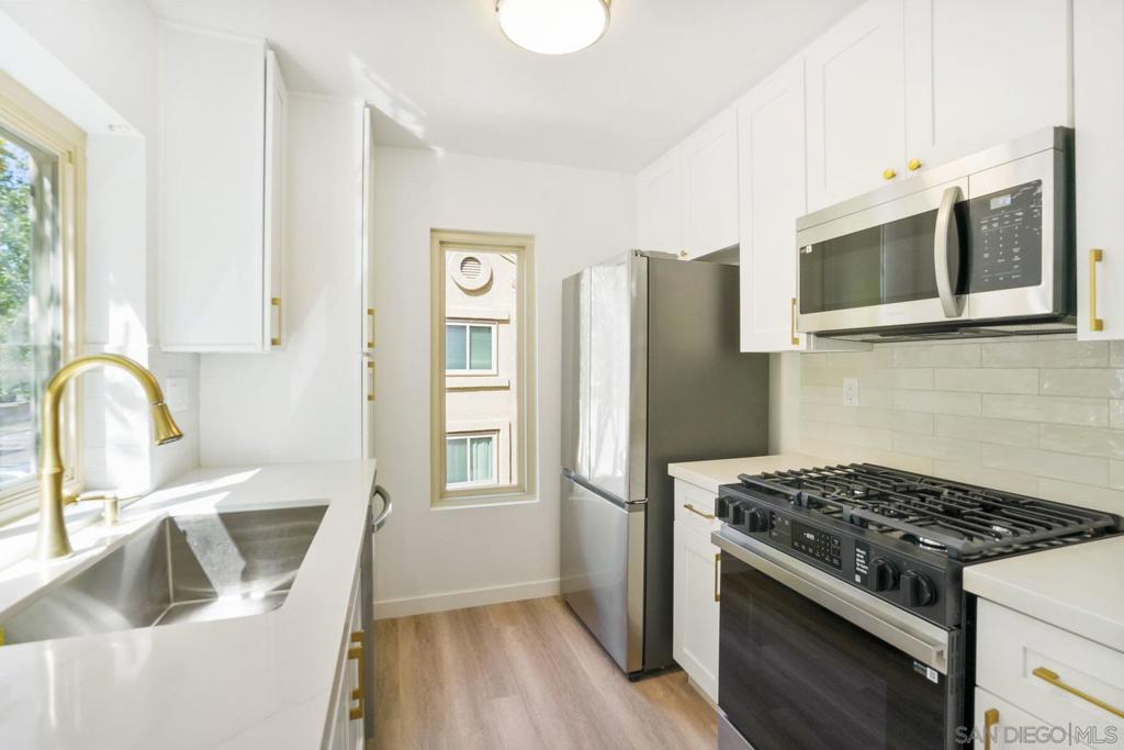 Welcome to this beautifully updated 1-bedroom, 1-bathroom condo with 598 sq. ft. of modern living space. Every detail has been thoughtfully upgraded, including a brand-new kitchen with sleek cabinetry, quartz countertops, designer tile backsplash, and stainless steel appliances. The open living area features large-format tile at the entryway, a stunning new fireplace surround, and dual-paned windows that fill the home with natural light. The spacious bedroom connects to a fully renovated bathroom with a new vanity, tile, tub, and fixtures. Additional highlights include in-unit washer/dryer, newer HVAC system, private balcony, ample storage, and a dedicated covered parking space. Situated on the top floor for added privacy, this home combines comfort and convenience in one of San Diego’s most desirable locations. Enjoy being minutes away from endless shopping and dining in Mira Mesa, close to major freeways, UCSD, and the tech hub of San Diego. Whether you’re a first-time buyer, downsizing, or looking for an investment, this turnkey condo offers the perfect blend of style and location.