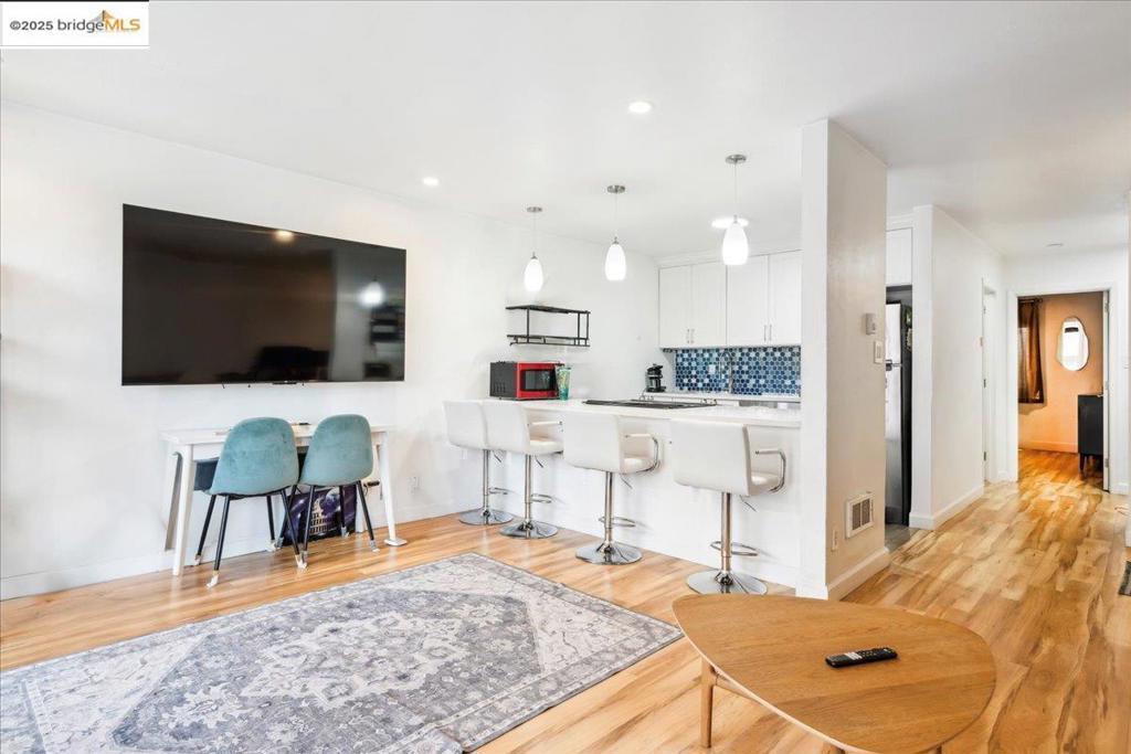 Incredible Opportunity! Recently renovated one bedroom, one bathroom Jack London Square condo with its own large private patio/dun deck The secured complex offers a range of recreational amenities: including a fitness center, pool, outdoor entertaining areas, plenty of guest parking. Enjoy the charm and history of the Port of Oakland community, surrounded by scenic walking paths, renowned restaurants, boutique shops, historic hotels, and public transit options like BART, Amtrak, and the Oakland/Alameda Ferry. The neighborhood also features a vibrant farmer’s market, seasonal festivals, and beautiful shoreline views. An assigned parking space and ample guest parking allows you to explore one of Oakland’s most iconic neighborhoods wiith friends and family,.