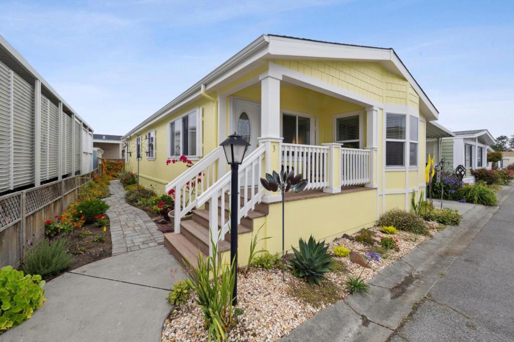 Charming 3-bedroom, 2-bath manufactured home located in Half Moon Bay's desirable 55+ coastal community of Canada Cove. The light-filled interior features an open-concept floor plan that flows seamlessly from the living room to the dining area and into a well-appointed kitchen with space for a breakfast table. The primary suite includes a walk-in closet and an ensuite bath with dual vanities and an oversized soaking tub. 2 additional bedrooms and a bath finish out the space. A laundry room adds everyday convenience. Recent upgrades include fresh interior paint and a newer roof. Additional highlights include a carport with an EV charger, a storage shed, and beautifully landscaped outdoor spaces. The backyard opens to a shared green space, offering a peaceful setting to relax. The community boasts a pool, community center, and is ideally located just moments from the beach, the Ritz-Carlton, and downtown Half Moon Bay with shopping and acclaimed restaurants. Enjoy easy access to Highways 1 & 92 for all your Bay Area commutes. Experience the best of coastal living in this inviting and move-in ready manufactured home.