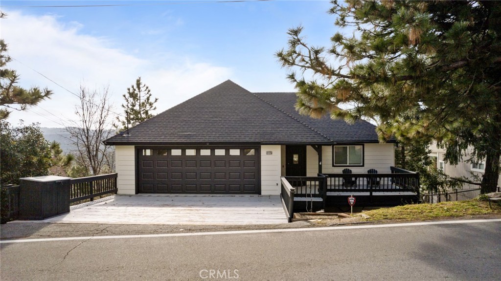 Ideally located with amazing view of North Bay and southern ridge line view! This home occupies a generous lot, providing many features. Level entry from two car parking deck and two car garage. Boasting four bedrooms, four bathrooms and multiple decks for the breath taking views. Main level open floor plan with fully remodeled kitchen, entertainers island, custom cabinetry , farmers sink and stainless appliances. Dining room with sliding doors to deck. The living room has wood burning fireplace. Main level primary suite with en-suite bathroom and private deck with lake view. Lower level has family room with two bedrooms and full bath. Fourth bedroom with en-suite bathroom is off game room with poker table and foosball table. Separate laundry room, two decks off this lower level. Notable enhancements, Rheem oversized tankless water heater, ring smart thermostat, recessed lighting throughout, neutral interior and exterior paint, functional floor plan.