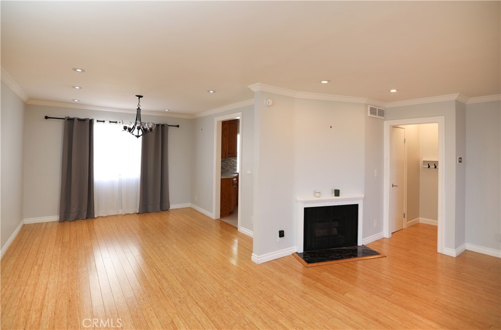 This stunning 4-bedroom, 3-bathroom townhome with an additional bonus room offers a total of five rooms, making it one of the largest units at 1,602 sq. ft. This property includes modern doors throughout, hardwood flooring, recessed lighting throughout and a custom walk-in closet in the primary, brand new installed modern closets in the bedrooms, as well as lots of natural light! This home features a built-in kitchen water-filtration system for crisp, clean water drinking and a 220-volt EV charging outlet in the private attached garage. A charming private patio just off the living room is ideal for relaxing, entertaining, and watching the views. The attached two-car garage provides direct access with lots of ample cabinetry for storage, while the bonus room downstairs can serve as an office, gym, and lots of extra storage. Enjoy a resort-style living experience with incredible amenities, including 7 pools, a spa, 6 tennis courts, pickle-ball courts, basketball and volleyball courts, a playground, dog park, clubhouse, recreation room, dry sauna, and 24-hour security patrol.