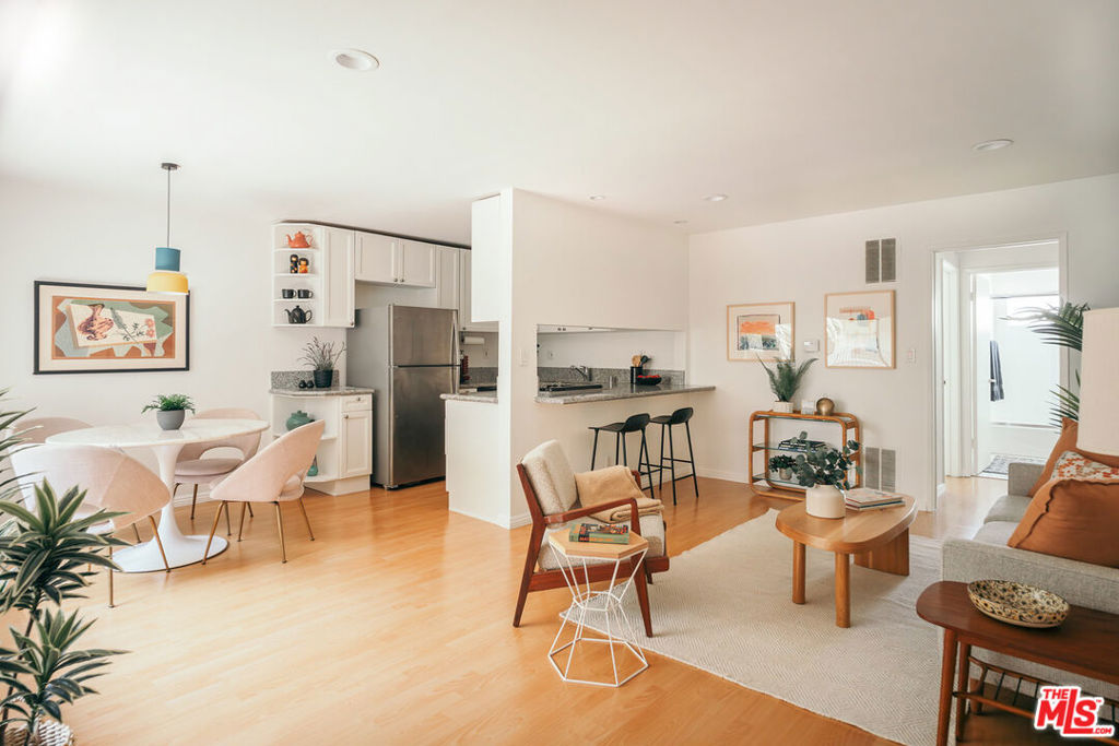 Located in the heart of Los Feliz Village, 1930 N Vermont Ave. #207 is a rare gem in one of the most sought-after pockets in all of Los Angeles - a light-filled unit in a beautiful building with some of the city's best shopping and dining right outside your door! Situated in a quiet back corner of the stylish 1960s streamline moderne building, enter past a courtyard of lush tropical greenery and find yourself in a cheery open living space with massive windows that bathe the room in natural light. The kitchen boasts stainless steel appliances, granite countertops, and ample cabinetry while the bedroom is a quiet refuge with peek-a-boo views of Griffith Observatory. The unit features truly exceptional storage space for a home of its size - inside, find not one but two oversized closets, and in the subterranean parking garage, find an additional private storage space and bike storage space. This is a home for those who want more than just square footage - it's for those who want to live well in one of LA's most desirable and culturally rich neighborhoods. Iconic institutions like Skylight Books, Alcove, Bru Coffeehouse, Fred 62, Los Feliz 3 Movie Theater, and the newly reopened Los Feliz Farmer's Market are all within a three-block radius (eat your heart out, NYC), and you're moments away from Griffith Park and so much more. With secure gated entry, one dedicated parking spot, community laundry room, guest parking, and low HOAs, this is a home like nothing else on the market - perfect for design-minded buyers seeking access, charm, and the vibrant city lifestyle only Los Feliz can provide.