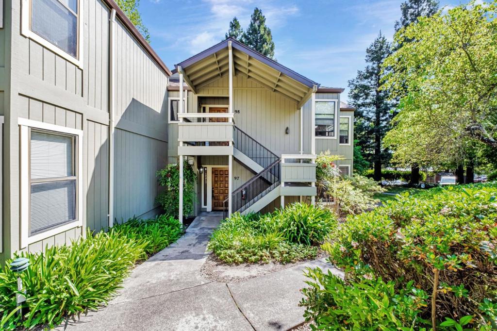 Welcome to 111 Bean Creek Rd #97 a beautifully updated ground-floor condo offering comfort, convenience, and thoughtful features. Nestled in a quiet corner of the complex, this rare gem features a spacious rear patio with peaceful tree views and is ideally located just far enough from the pool for privacy. Enjoy fresh paint, new flooring, stylish fixtures, and wide hallways and bathrooms designed for accessibility. The bathroom and shower include grip handle bars for added safety. In-unit laundry (washer/dryer included) and an updated kitchen complete the package. A highlight is the rare, oversized garage about 40% wider than standard with shelving, a workbench, and just 2530 feet from the unit. Located near the community gate for easy access to Nob-Hill Foods, dining, Ace Hardware, and the Tesla Supercharging station. This move-in ready home is perfect for anyone seeking low-maintenance living in a prime Scotts Valley location.