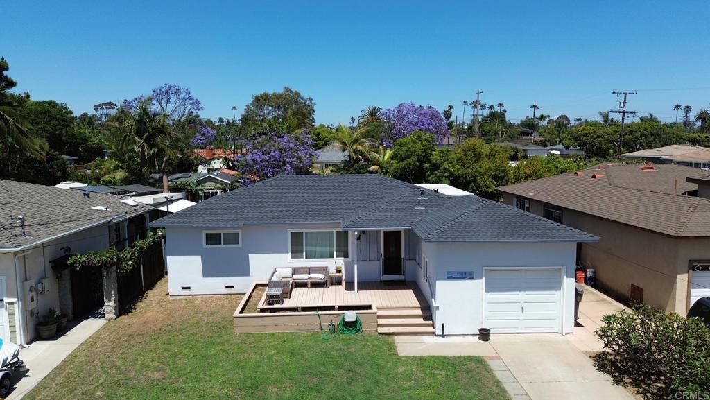 Welcome Home to South Oceanside! This highly desirable single-level 3-bedroom, 1-bath home combines coastal charm with modern updates for the perfect beachside lifestyle. Upgrades you’ll love: 220v line for EV charging, brand new roof (2021), and updated plumbing with a new sewage line (2020) that includes a transferable warranty and service plan. Modern living: Remodeled kitchen and bathroom, plus ceiling fans installed throughout the home for year-round comfort. Indoor & outdoor living: A spacious second living room with a wet bar (featuring a wine fridge and prep sink) makes entertaining a breeze. Step outside to enjoy a large backyard with mature landscaping, automatic irrigation, multiple fruit trees, and a generous deck perfect for gatherings. Beach lifestyle: Rinse off after a surf session or wash your pup in the convenient outdoor shower. Ideal location: Just a short stroll to a neighborhood playground, community pool, and of course—the beach! This is your chance to own a beautifully updated home in one of Oceanside’s most sought-after neighborhoods.