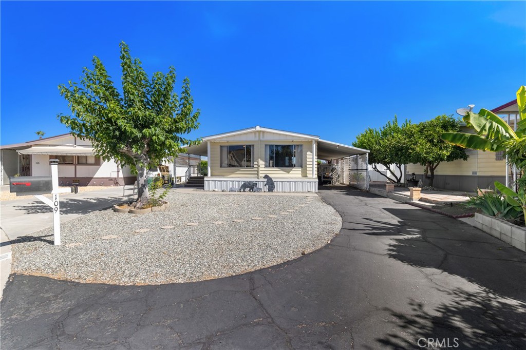Welcome to Golden Coach Manor, one of Hemet’s most desirable 55+ senior communities. This charming 2 bedroom, 2 bath home has been thoughtfully updated and is ready for its new owner. Recent upgrades include a brand-new A/C system, new roof, new washer and dryer, new refrigerator, and a brand-new double oven with electric cooktop, providing peace of mind and convenience from day one. Inside, you’ll find a spacious living and dining area accented by a built-in, china hutch, open floor plan, large hallways. Small dog door to large backyard. Step outside to enjoy one of the largest fully fenced backyards in the community, complete with a built in decorated covered BBQ area that’s perfect for gatherings with family and friends. Nice orange tree. Two oversized storage sheds provide plenty of space for tools, hobbies, or seasonal items, while a wheelchair/scooter lift system ensures easy accessibility. What makes this community so special? Lower space rent only $635 per month plus utilities paired with an incredible variety of amenities and activities designed for the active, mature adult. Residents enjoy a dog park, heated swimming pool, spa, shuffleboard courts, and a welcoming clubhouse featuring billiard and card rooms, a lounge, library, and banquet hall. There is also on-site RV storage available for an additional fee (check with office), along with plenty of guest parking for visiting friends and family. With its unbeatable combination of affordability, comfort, and community spirit, this home is ideal for those seeking a full-time retirement retreat or a snowbird getaway. Don’t miss this beautiful oasis your perfect next chapter awaits at Golden Coach Manor!