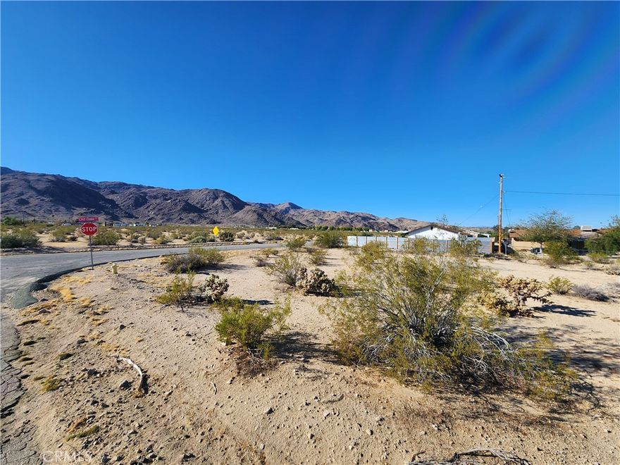Residential Lot, 0.19 Acres (APN: 0616-111-05) GPS: 34.13181, -116.077505This residential lot is located in Twentynine Palms, CA. Twentynine Palms has zoned this property Residential (RS-4). The city has zoned the property for single family homes, with a maximum of 4 units per acre. Imagine building your desert getaway and waking up to bright desert sunrises, panoramic views of rugged mountains, or dark starry nights. Overhead electricity is on site. The Twentynine Palms Water District services the area and provides water in the street. Residents have septic tanks for their sewer needs. Living in Joshua Tree, CA, offers a unique blend of natural beauty and laid-back desert living. Endless opportunities for outdoor adventures are a short drive away in Joshua Tree National Park. There's always something exciting to explore. Plus, the tight-knit community fosters a sense of belonging, with local shops, art galleries, and events showcasing the area's vibrant culture. Whether you're seeking tranquility or adventure, Joshua Tree welcomes you with open arms. This property does not yet have an address. While the boundary lines on the map offer a glimpse, they are only approximate. A Buyer should verify boundaries, zoning and utilities, ensuring every aspect aligns with their vision for the property.