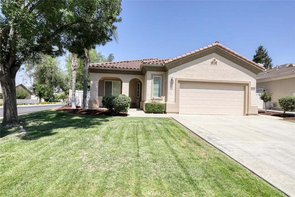 Lovely home in gated 55+ Solera at Kern Canyon community. Resort style living - two bedroom, two bath, plus office in a corner lot home located conveniently close to club house and amenities. Features include an open floor plan, great room with updated wood look laminate flooring that opens to dining room and kitchen. Kitchen features granite counter tops, breakfast bar, built-in microwave, pantry. Laundry room off the kitchen area features a wet sink, counter, storage cabinets and leads to oversized two car garage with cabinets. New hot water heater May 2025. Primary bedroom features updated wood look laminate flooring, large walk-in closet, en-suite large bath with jetted tub and separate easy walk in shower. Ceiling fans throughout. Window treatments including shutters, blinds, and curtains stay. Great outdoor covered patio, yard landscaping (Meyer lemon and orange tree), and walkways. Community amenities include gym, pool, spa, tennis, pickle ball, and more. Fridge. washer, and dryer included. Some photos show common community areas.