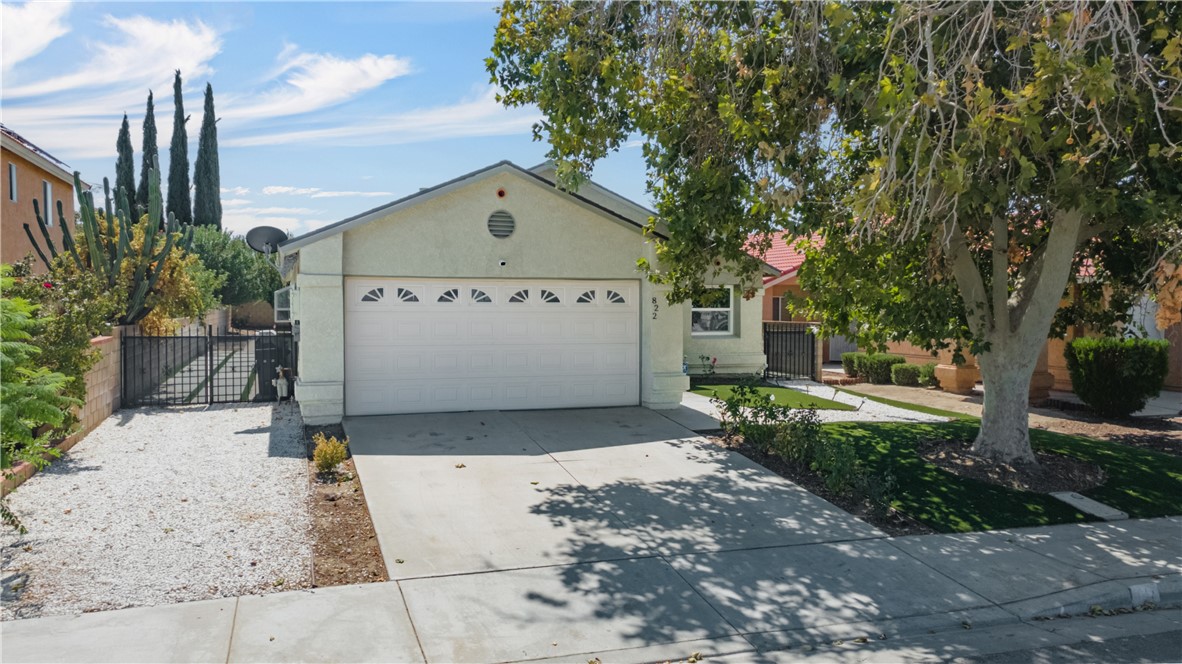 This home is a true gem, offering incredible value with a new roof, new windows, fresh paint, and beautifully landscaped low-maintenance, and water saving yards. Enjoy the stunning covered patio with stamped concrete, remodeled bathrooms, and generously sized bedrooms. Extras include paid off solar, a water softener system, washer, dryer and refrigerator making this home move- in ready. Though modest in size, it's packed with style, upgrades and comfort to include a cozy fireplace. This is an exceptional deal you won't want to miss.