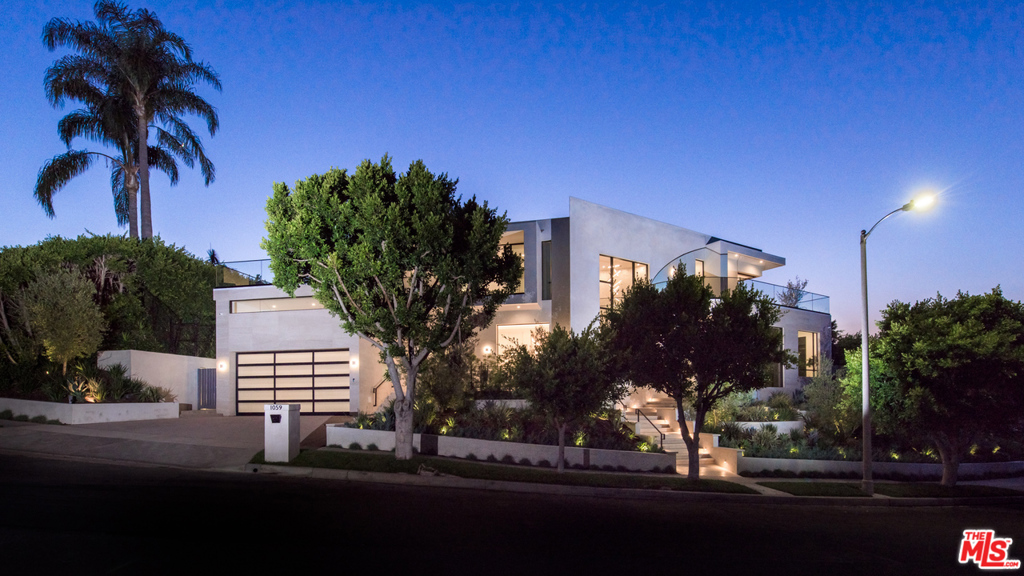 Located on one of the best streets in Beverly Hills Post Office, this exquisite new construction home has been designed & developed with the utmost attention to detail. Grand scale rooms & an influx of natural light awaits, with a well-appointed floor plan & the highest quality finishes. The formal entry boasts a cascading waterfall & opens to the office. The great room features a fireplace, bar & walls of retractable glass that open to the garden. The eat-in chefs kitchen boasts a large island with breakfast bar, professional appliances and wine cellar & flows seamlessly to the family room. A master suite to rival the finest resorts awaits upstairs with sensational canyon views, designer-closets, 1450SF of wrap-around balconies, & a spa-like ensuite bathroom. 4 addl en-suite bedrooms and SMART home technology complete the property. The private yard offers mature landscaping that compliments the sparkling pool/spa, firepit & outdoor kitchen.