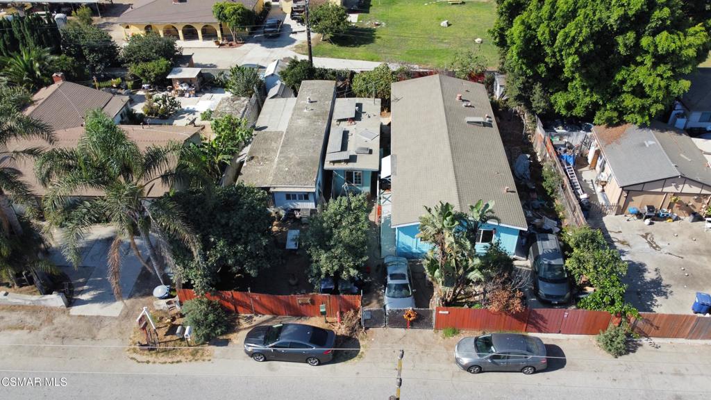 Fantastic fixer opportunity in Oxnard! This property is uniquely situated in the middle of a SFR neighborhood and is registered with the Western Mobile Home Association (WMA), ID 28197 'Wonderland Mobile Home Park.' It includes two manufactured homes plus a third fixed structure, along with 8 owned (paid-off) solar panels that add extra value. Current rental income is about $2,800/month, making it appealing for investors.The property is zoned RE-10,000 sq ft/MHP, which allows both residential estate use and operation as a mobile home park. While RE-10,000 zoning typically requires a 10,000 sq. ft. lot, this 7,800 sq. ft. parcel is a legal non-conforming lot, meaning it can continue to be used and improved as it is. The Mobile Home Park designation provides flexibility to keep operating with manufactured homes, while the City of Oxnard's Area Plan supports low-density residential (2-4 homes per acre), consistent with the surrounding SFR neighborhood.Buyers have multiple options; retain it as an income property, redevelop into a SFR residence, or renovate and flip for profit. Conveniently located near schools, shopping, and major commuter routes, this is a rare chance to create value in a desirable location.