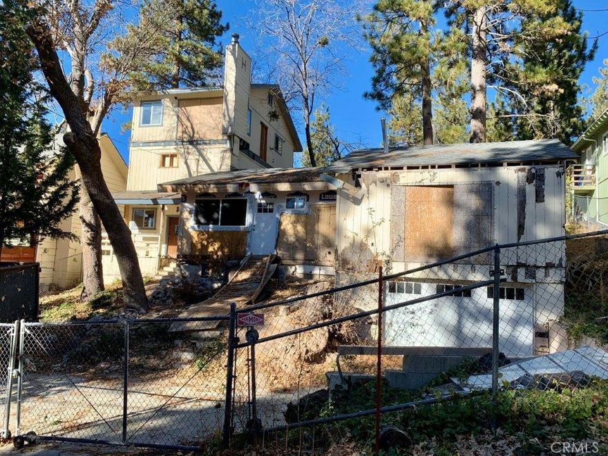 **FIXER!**   Extensive renovation in progress on this unique multi-level mountain home offering exceptional upside and flexibility. This 2,704 sq ft residence features a dramatic open living area with vaulted ceilings, fireplace, recessed lighting rough-ins, and a spacious layout designed for modern living. The home includes a lower-level basement, a large main living level, and an upper level with additional living space.

Significant improvements have already been completed, including structural framing, new roof, plumbing rough-ins, electrical rough-ins, recessed lighting, ducting, and multiple bathroom layouts in progress. The floor plan offers multiple configuration options, including the potential for a third bedroom, studio, guest suite, or mother-in-law quarters. An upper-level kitchen area exists, creating added flexibility for extended living or income potential.

Much of the heavy and costly work has been done, providing a strong foundation for an experienced buyer to complete the project and add value. Architectural plans, structural calculations, and prior inspection documentation are available for review. Property is being sold in its current condition.

Ideal opportunity for a contractor, investor, or buyer seeking a substantial renovation project.

Cash or hard-money buyers recommended.