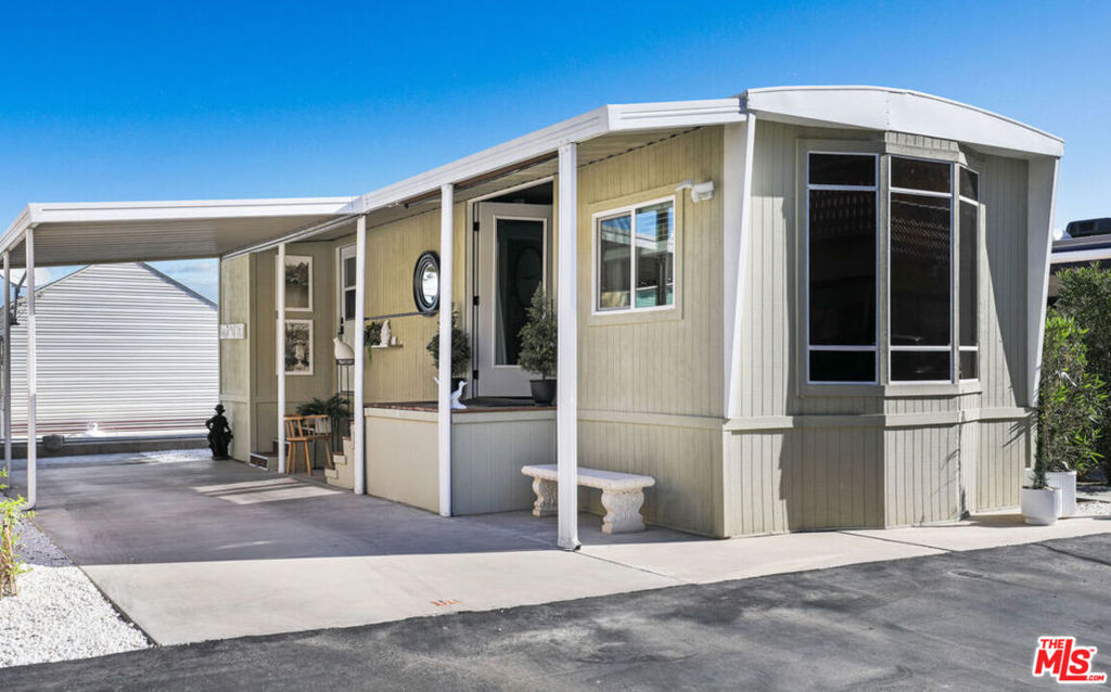 Chic design meets affordability in this rare Sungate gem. Guaranteed to make you say, "Wow!" the moment you walk in the door, this well appointed "tiny home" has been fully remodeled and renovated by a professional designer. Offered turn-key, fully furnished, & move-in ready, it features a high-end kitchen w/ dining area, spacious living room w/ fireplace, and a generous hallway leading to the luxury bath & bedroom. Cleverly designed with lots of storage inside & out AND an indoor washer & dryer, this home will make you swoon. Just steps from the clubhouse and pool, it's perfectly positioned for fun and relaxation. Close to shopping and restaurants, Sungate is one of the nicest "tiny home" communities in the Coachella Valley and is a 55+ community.