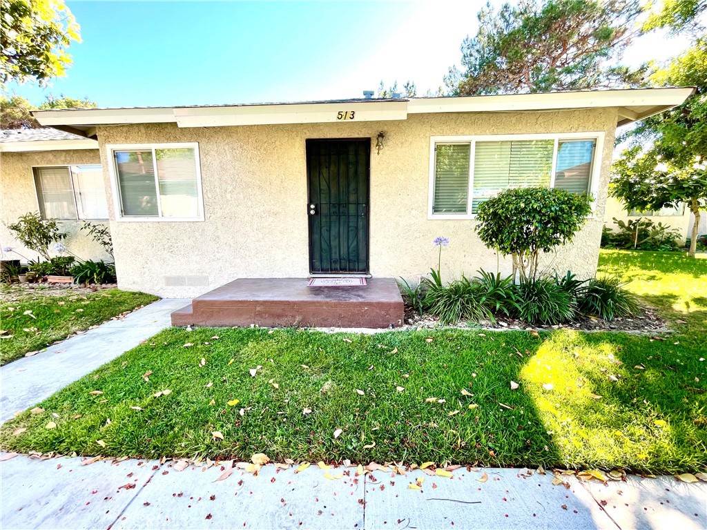 Welcome to this cute end unit. This two bedrooms and 1 and one half bathrooms home. The kitchen has a nice size pantry, stove, dishwasher, washer and dryer. Open up the front and back door for a nice breeze when it gets warm and or use the ceiling fan in the living room. Laundry is located in the kitchen and has a folding door that can be closed when guests are over. There is room for a dinner table adjacent to the kitchen. A unique feature is the folding door that could be utilized to separate the kitchen from the living room. The primary bedroom has a private half bathroom (toilet and sink). The other bathroom is located in the hallway that has a tub with shower inside. A hallway closet is available for storage. The unit includes one large one car garage with storage space and one assigned parking space not enclosed.