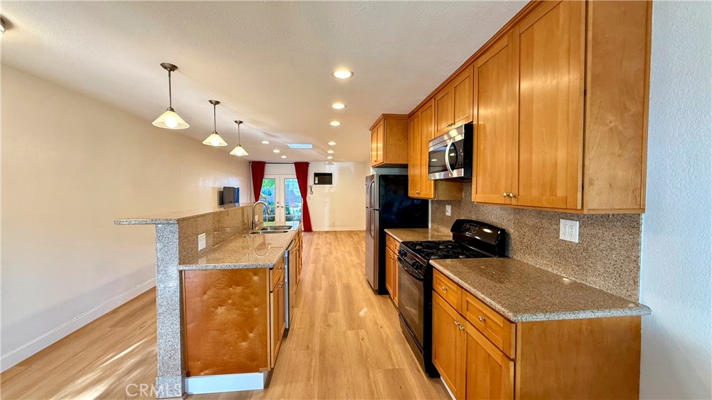 Spacious ground-level 2 bed / 1.75 bath home in a quiet, well-maintained Huntington Beach community. Recently updated with brand new luxury vinyl flooring and fresh Chantilly Lace paint, this light-filled unit offers a spacious open floor plan, skylight, full kitchen with refrigerator, stainless steel dishwasher, gas range/oven, granite countertops, and ample cabinet space. Bedrooms feature mirrored closets and plenty of storage, while each room is equipped with wall-mounted A/C units. Bathrooms include comfort-height toilets and vanity storage.
Enjoy outdoor living with French doors opening to a private patio with drip irrigation, plus a semi-private retreat off the primary bedroom. Community amenities include on-site laundry with Speed Queen commercial machines. Reserved parking and garage options available. Water & trash included; tenant pays gas and electric. Pet-friendly with deposit and monthly pet rent.
Prime Location: Across from Bella Terra Mall (Costco, Costco Gas, Starbucks, Whole Foods, Kohl’s, restaurants, movie theater, Old World Village). Close to Target, Sprouts, Walmart, and South Coast Plaza. Easy 405 Freeway access and just minutes to Huntington Beach Pier, Pacific City, and local parks.