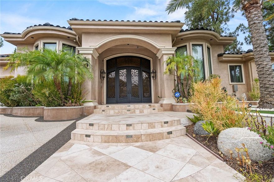 Built in 2008, this single-story gated Mediterranean Villa is an architectural masterpiece that combines privacy, prestige, and unmatched craftsmanship. A dramatic entry with soaring ceilings, imported marble with onyx inlay, and 24" Italian limestone floors sets the tone for the open, elegant floor plan.



Designed for grand entertaining, Milgard French doors create seamless indoor-outdoor living, opening to travertine-tiled patios, a PebbleTec pool with Bellagio-inspired mosaic stone coping, an elevated spa, and a cascading waterfall with jet sprays. The outdoor kitchen and loggia are fully equipped with granite counters, Viking grill, warming drawer, and refrigerator—perfect for California living at its finest.



The chef’s kitchen features custom solid hardwood and beveled glass cabinetry, a large granite island, and professional-grade Miele and Thermador appliances. The primary suite offers a luxurious retreat with a spa-like bathroom and oversized walk-in closet. Spacious secondary bedrooms each feature lavish en suite baths.



Additional highlights include a grand living room, formal living room with full bar, elegant dining room, premium interior and exterior lighting, and fully owned solar. Every detail of this trophy estate reflects uncompromising quality and timeless design.



Buyer’s agent and buyer are advised to perform their own due diligence on all information provided in this listing. Seller and seller’s agent make no guarantees and shall not be held responsible for any inaccuracies.



Major Price Just Reduced! Motivated Seller – Don’t Miss This Opportunity, Call Agent Today!