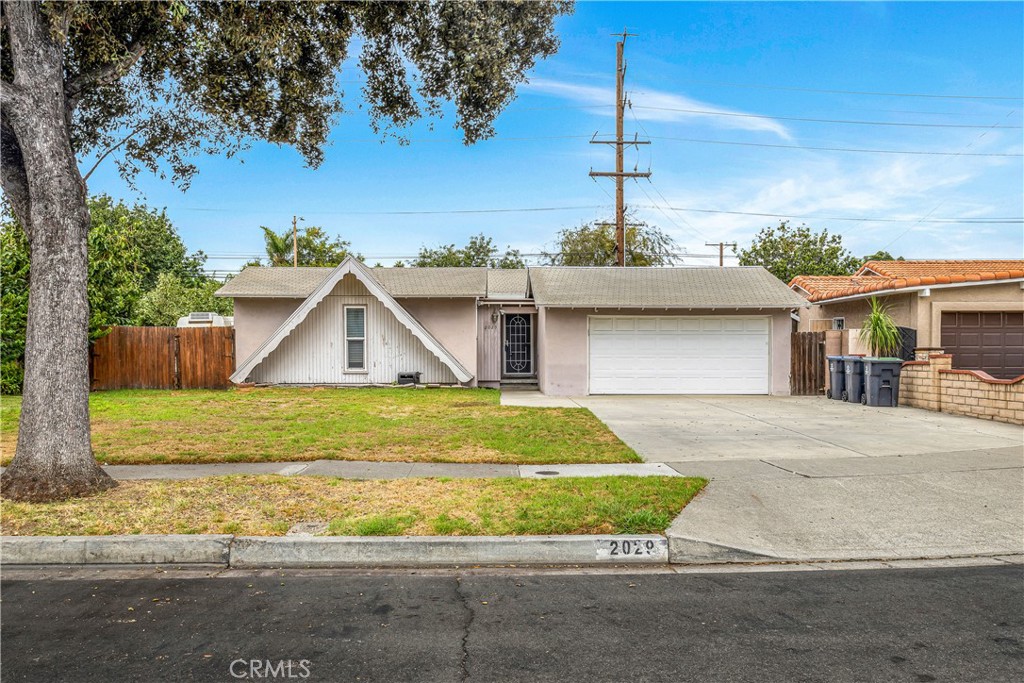CUL-DE-SAC HOME with a LARGE LOT, in a PRIME LOCATION! This original home is located in one of the sought-after neighborhoods in Santa Ana. It offers treelined streets with an extra-large driveway, a large front yard, and a side yard. Step inside to find a beautiful fireplace with granite tiles, an extended sunroom off the kitchen with white shutters, a kitchen and dining area with porcelain tiles, and timeless wood floors throughout the rest of the home. This property still has plenty of space in the back for backyard entertaining. Concrete patio area, grass yard, on-site storage with a Tuff Shed, and garden boxes to start your own harvest of fresh vegetables. You have unbeatable access to South Coast Metro’s dining, shopping, and freeways. This property is a rare find. Don’t miss your chance to make it your own. Schedule a private showing today!