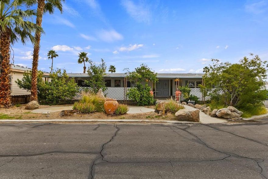 This 2 bedroom 2 bath turn key furnished manufactured home is located on a corner lot in beautiful, family friendly Sky Valley Resort just steps from the pool. Enjoy 2 outdoor living spaces and mountain views, fruit trees, extra large primary bedroom and primary bathroom, 2 living rooms,tile flooring and a beautiful fireplace in the main living room, and a spacious dining area, Enjoy the rare and natural mineral water in the pools and spas, Cafe, Chapel, tennis, Pickle Ball, Farmers Market, the Wild West wash, grassy knolls and duck filled ponds, open Desert hiking and more. Also enjoy the warm Winters, blue skies, the new Acrisure Arena, golf tournaments, tennis tournaments, art festivals, music festivals, fine dining and shopping on El Paseo and Palms Springs and so much more! This is a perfect permanent home or a fun vacation home to make memories!