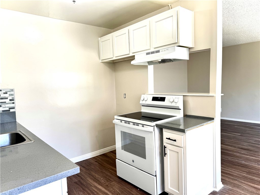 Enjoy coastal living in this beautifully updated 2-bedroom, 1-bath downstairs unit in Long Beach, located less than a mile from the shore. MOVE IN BY 9/1/25 and GET 2 WEEKS FREE! With over 1,000 square feet of living space, this home offers comfort, style, and convenience in one of the city’s most desirable areas. The recently remodeled kitchen features brand new countertops, a new electric stove, a modern tile backsplash, and all-white cabinetry that gives the space a clean, contemporary feel. Throughout the home, you'll find wood vinyl plank flooring, adding warmth and durability to each room. The spacious layout includes two well-sized bedrooms, a bright living area, and plenty of storage to meet your everyday needs. To top it all off, this unit comes with its own private garage—a rare find so close to the beach! Don’t miss your chance to live in a roomy, updated home just minutes from the sand. Schedule a viewing today! No pets, no smoking, qualifying credit and income is a must.