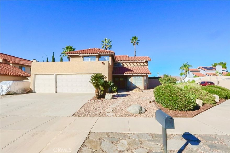 This immaculate 3-bedroom, 2-bathroom Moreno Valley home is completely turnkey and loaded with desirable features. A formal double door entry opens into a bright, airy living space defined by soaring cathedral ceilings and modern recessed lighting. The home offers perfect comfort with central air and heating and a cozy family room fireplace. The well-appointed kitchen includes both a breakfast nook and a breakfast counter/bar. The spacious primary suite features a full bathroom with double sinks and a bathtub. Architectural details like swing-in doors add a touch of custom elegance. The backyard is a private, low-maintenance paradise secured by vinyl fencing, complete with a concrete patio and your own private, heated pool and spa. This home is the complete package.