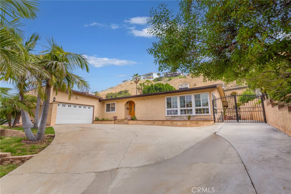 Glencrest Hills Beauty features 3 Bedrooms, 2 Bathrooms, just under 2,000 sq ft (one story), a pool and bonus room. Large and bright Living/Dining Room with Fireplace, crown moldings, custom window shutters, recessed lighting and views from the front. Remodeled kitchen with Granite countertops, stainless steel appliances and abundance of counter and closet space. The family Room features a fireplace, views of the exterior grounds and easily accessible to the kitchen. A very large Master Suite featuring a double closet, sliding doors leading to the exterior, remodeled bathroom with double sink. Bonus room (approx. 500 sq ft) with small kitchenette, sitting area, bathroom and bedroom and laundry unit outside. Additional Updates: newer roof, recessed lighting and crown moldings throughout, plenty of closet space in the hallway and linen closet, stackable washer/dryer in hallway, partial original hardwood floors, partial/peek-a-boo view from the bedroom and side exterior. Exterior features: Newly replastered pool with newer pool equipment including filter and pump, large sitting covered sitting area, RV/Boat parking, 2 car garage with direct access to the house through the bedroom, extra-large driveway for plenty of cars or toys, views of the valley and Burbank Airport. Close proximity to restaurants, shopping, transportation, movies, entertainment and surrounded by great neighbors.