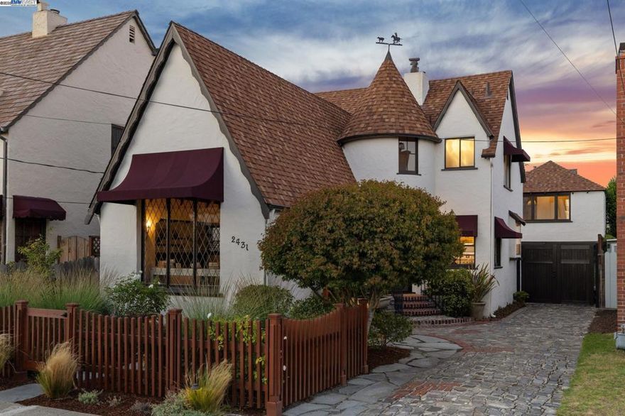 A weather vane-topped turret, a leaded glass picture window set in a stucco exterior, steeply pitched roof lines, a rustic cobblestone driveway & a lush native garden behind a sweet picket fence all add to the irresistible fairytale charm and curb appeal of this wonderful storybook-style Tudor Revival home! Located just blocks from the shoreline + South Shore Center amenities, this 1938 home features 2BR, 2.5BA, formal living/dining rooms, a kitchen with an adjoining breakfast room, a spacious pantry/mudroom & a large, finished loft space over the detached garage. Loads of fanciful storybook details include a whimsical interior stairway, a w/b fireplace with a slate/stone surround built into an inglenook, original cupboards and bookcases (and a turret + built-in settee!), wall niches & a fabulous living room barrel ceiling adorned with wood panels and beams. Wood floors throughout, new light fixtures, an updated primary BR, quartz kitchen counters + a huge pantry/mud room off the kitchen that provides additional storage and/or kitchen expansion potential. A spacious loft + full bathroom above the detached garage makes a great home office, family room or guest/teen space (236 SF). A fabulous home, great location near top schools, great shopping + many convenient commuter options!