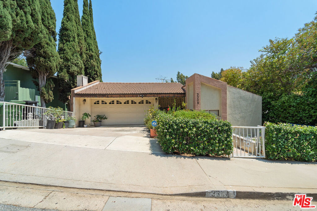 An opportunity to reimagine the space into a thoughtfully updated home tailored to your vision. Offers elevated views and convenient access to freeways, major studios, Universal City, and a wide range of dining options across Los Angeles. Includes a two-car garage and additional parking on the concrete driveway for everyday convenience.