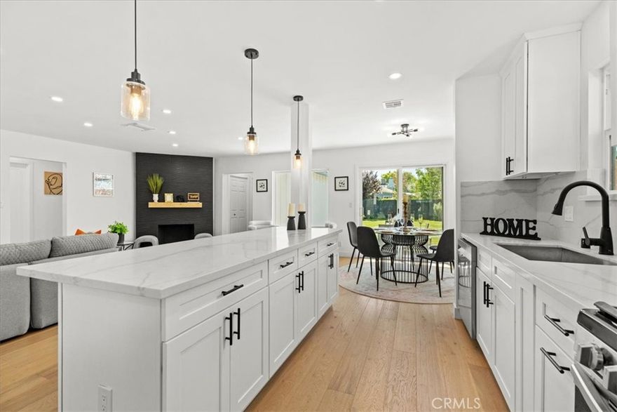 Situated on a tranquil street in the heart of Sherman Oaks, this impeccably remodeled residence features 3 bedrooms and 2.5 bathrooms, along with a beautifully appointed 1-bedroom, 1-bathroom ADU. Offering a combined 2,028 square feet of thoughtfully designed living space, the home seamlessly blends modern elegance with everyday comfort. Ideally located just moments from the highly sought-after Kester Elementary School, this property presents an exceptional opportunity in one of the Valley’s most desirable neighborhoods.



Inside, you’re welcomed by an open layout that feels both fresh and inviting. Clean lines, warm tones, and stylish finishes give the home a comfortable and modern feel. The kitchen is a true showstopper, centered around a large island that’s perfect for cooking, gathering with friends, or casual family meals. It opens right into the main living area, creating a space that’s great for entertaining or just kicking back and relaxing.



Step through the sliding glass doors and you’ll find a generous backyard with a big grassy area, ideal for outdoor get-togethers, kids at play, or winding down after a long day. There’s even plenty of space to add a pool without taking away from the yard’s functionality.



The newly built primary suite, approximately 500 square feet, feels like its own private retreat. It features an oversized shower with beautiful tilework, a dual-sink vanity, and a spacious walk-in closet. The other bathrooms are just as polished, with modern vanities and sleek fixtures throughout.



The detached 400-square-foot ADU is the perfect bonus. Whether you use it for guests, extended family, a home office, or rental income, the possibilities are wide open.



This is a home where comfort, quality, and location all come together. It’s stylish, welcoming, and ready for its next chapter.



Check out the video!