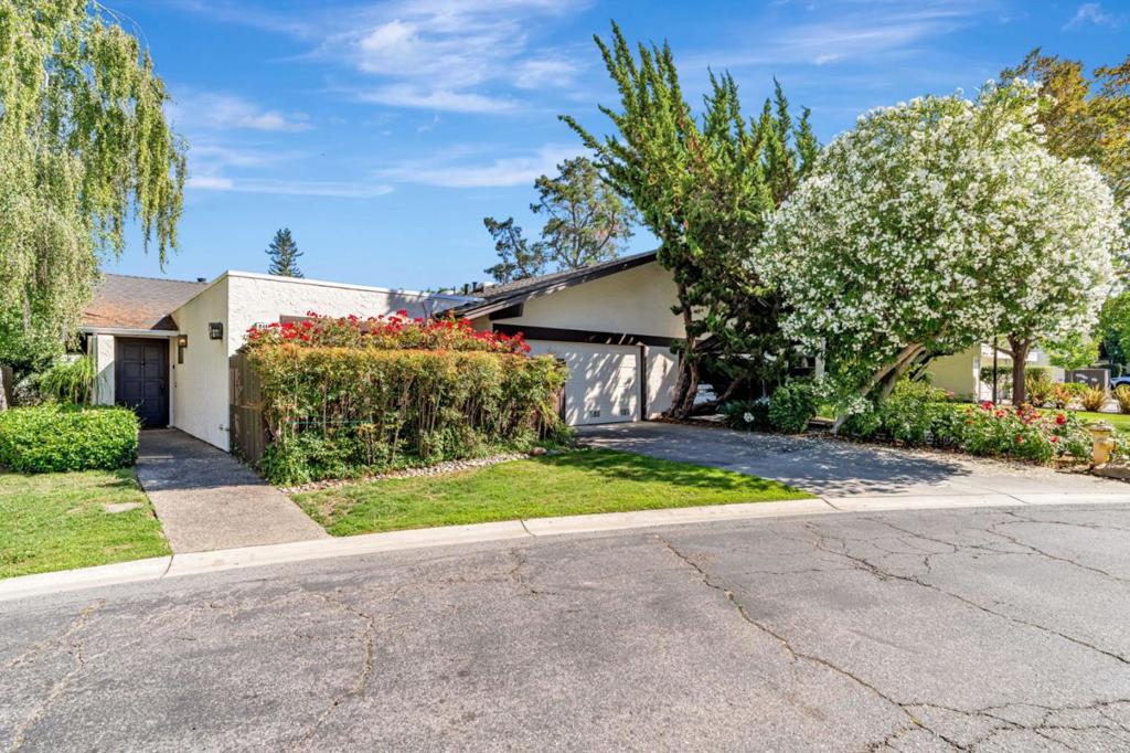 In the heart of Silicon Valley! Located in sought-after Sharon Heights, this two bedrooms, two-bathrooms, one story end-unit townhome, provide a rare opportunity for someone looking to downsize or a family looking for close proximity to top-rated local schools, shopping, Stanford University, parks and much more. The entry with a view of light and delightful atrium, leads to a spacious living/dining room with natural light and a cozy fireplace and Indoor/outdoor access to the large patio. In addition, the adjacent family room with a wet-bar, offers more space for wonderful entertainments, gatherings. Two car garage. The HOA fee includes exterior painting, fencing, garbage, roof, insurance (common area, earthquake, & hazard), management fee, and the maintaining of the pools and newly remodeled Club House for your larger entreatment and gatherings. Likewise, the water, trash, basic cable are covered in the monthly fees. New roof was installed 2024 on the property. This lovely home in Sharon Oaks community, with ALL the amazing amenities and potential is not to be missed!