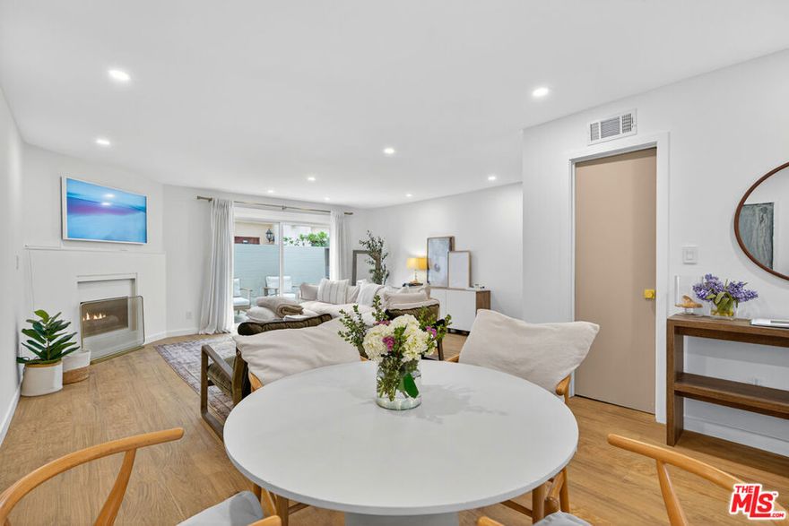 Welcome to 1443 25th Street #2  a fully remodeled townhouse that perfectly blends luxury, comfort, and convenience in the heart of Santa Monica. This exceptional 2-bedroom, 2.5-bathroom home has been meticulously upgraded from top to bottom with high-end finishes, stylish furnishings, and thoughtful touches throughout, offering a true turnkey living experience. Step inside to a bright and airy open-concept living area where natural light pours through oversized windows, highlighting the warm elegance of hardwood flooring that extends throughout the entire home. The spacious living room centers around a charming fireplace, creating a cozy atmosphere perfect for relaxing evenings or entertaining guests. Just off the living area is a beautifully designed dining space that flows effortlessly into the modern kitchen. Outfitted with stainless steel appliances, granite countertops, and abundant cabinetry, the kitchen combines function and sophistication ideal for everyday living and hosting alike. Upstairs, you'll find two generously sized bedrooms that offer both comfort and privacy. The primary suite is a true retreat, featuring a spacious walk-in closet, and a completely renovated ensuite bathroom. This spa-inspired bathroom showcases a separate walk-in shower, double sinks, a separate vanity area for added convenience, and high-end designer finishes that create a serene, luxurious ambiance. The second bedroom also offers ample space and access to its own well-appointed full bathroom, making it perfect for guests, a home office, or family. One of the standout features of this home is the private outdoor space. Step out onto your own secluded patio, ideal for enjoying morning coffee, dining al fresco, or simply unwinding in the California sunshine. Additional conveniences include in-unit laundry, making day-to-day living effortless, as well as central air conditioning and heating to ensure year-round comfort. The home also includes secure, gated parking within a well-maintained and quiet community, providing both peace of mind and ease of access. Located just minutes from the beach and some of Santa Monica's best offerings, this townhouse is ideally positioned near top-rated schools, beautiful parks, boutique shopping, and renowned restaurants. This home offers an unparalleled lifestyle in one of L.A.'s most desirable neighborhoods. This home is ready for you to move in and enjoy.