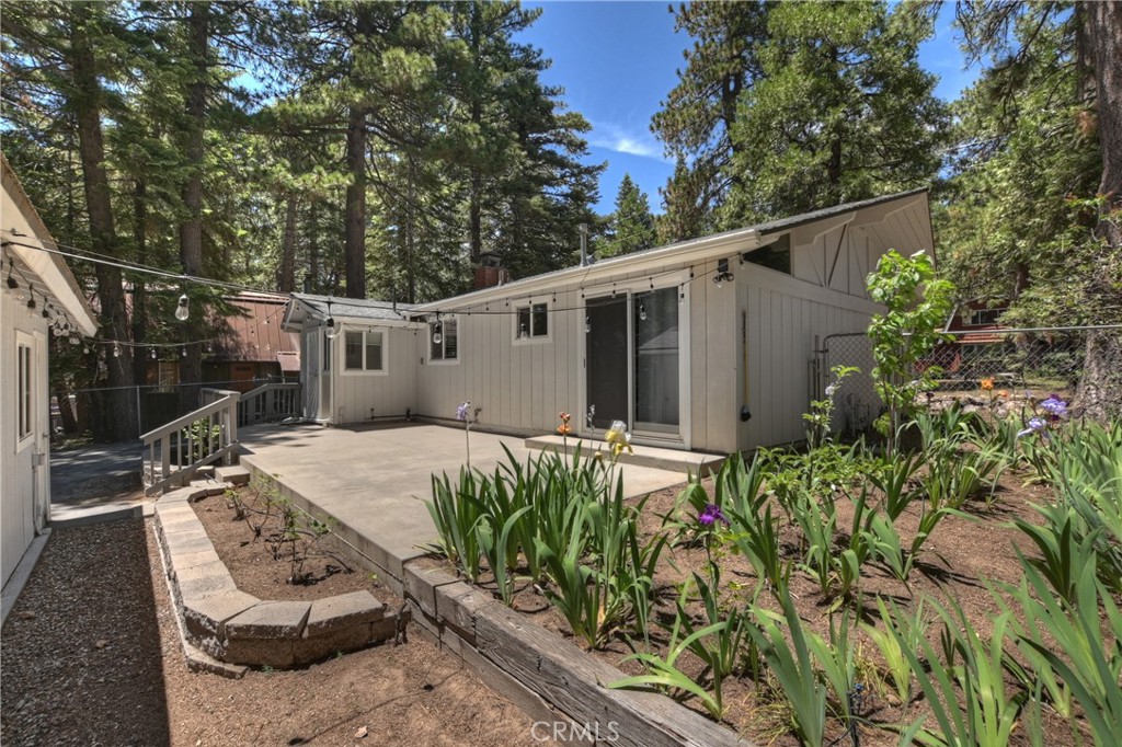 What a single level treasure! This home fits the bill for so many buyers-perfect starter home, perfect weekend get-a-way and the perfect retirement home! Well thought out for easy mountain living, this attractive home has level access, loads of parking (included RV!), wood burning fireplace insert, fenced yard, garden areas, large rear patio and a garage with a half bath and gas heater! This single level home is move in ready with upgraded wood look laminate floor, newer paint and carpet and updated kitchen. The home features the living room with a brick fireplace, dining area, an open kitchen, 2 bedrooms (one has a slider out to the rear patio), full bath and a laundry room. There’s also a large storage shed attached to the garage offering you lots of room for your tools and toys! Affordably priced, this one is not to be missed!