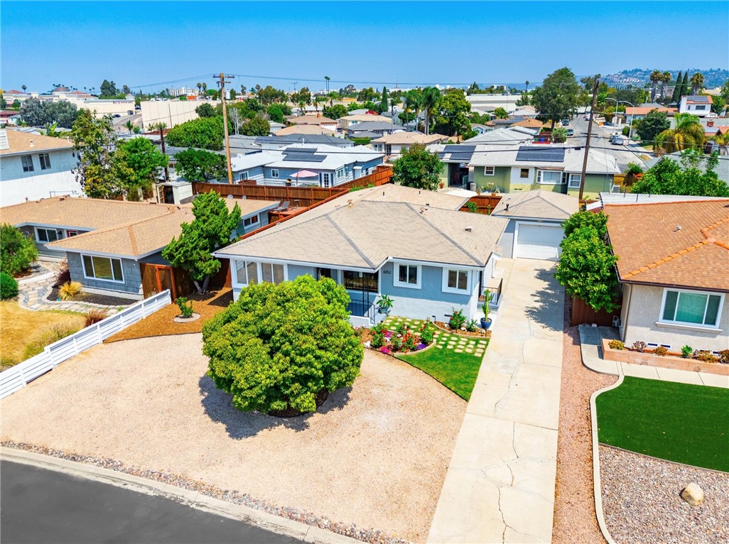 Honey, stop the car! Welcome to the home affectionately known as “The Box Checker”. Located at 6152 Lorca Drive in the heart of Rolando Village—one of San Diego’s most desirable neighborhoods—this charming residence offers the perfect blend of comfort, charm, and convenience. With three spacious bedrooms, two beautifully remodeled baths, and two rather large walk-in closets, the home is bathed in natural light and offers ample off-street parking for multiple cars. Best of all, the home is gentle on the budget with no HOA fees or extra fees. From the moment you arrive, the enormous front yard and covered porch entry make a lasting first impression. The owners have lovingly cared for the property, and their pride of ownership shines in so many details. Step inside to find a generous living room and dining area, both graced with oversized postcard-like windows that flood the space with sunlight and create a warm, welcoming ambiance. The thoughtful floor plan flows seamlessly, making it ideal for both everyday living and entertaining. The guest bath has been fully remodeled with a tall glass shower, new vanity, and stylish built-in storage. The master suite is a true retreat, featuring a spacious walk-in closet, an en suite bath with both shower and tub, and direct access to the private yard through a vinyl sliding glass door. Outside, a wraparound redwood deck provides the perfect space for relaxing or hosting friends, stargazing after an outdoor BBQ, or picking fresh fruit from the home's mature, producing citrus trees. There's even a detached garage which offers full-size laundry and added storage. The moment you step inside the home, you will notice some thoughtful, architectural touches such as a coffered ceiling, built-in shelving and hardwood floors swhich contribute to the home’s character. The location is unbeatable—within walking distance to shopping, dining, and retail, close to San Diego State University, and offering easy access to transportation. This is more than just a house—it’s a thoughtfully maintained home that truly checks every box.