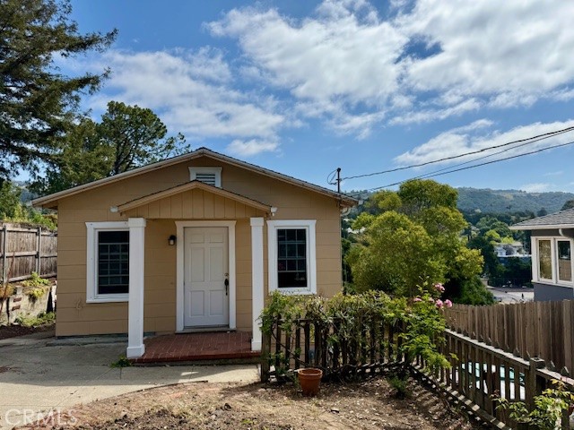 Refreshed, cute cottage on a good sized lot! Hardwood and new vinyl flooring, recent paint inside and out. Newer bathroom fixtures. Double-pane windows. The site slopes to the rear with lots of potential to expand or build! Some views of the hills. Unfinished basement with outside entry is used for laundry facilities and storage. Driveway parking is available. So much charm to make your own!
