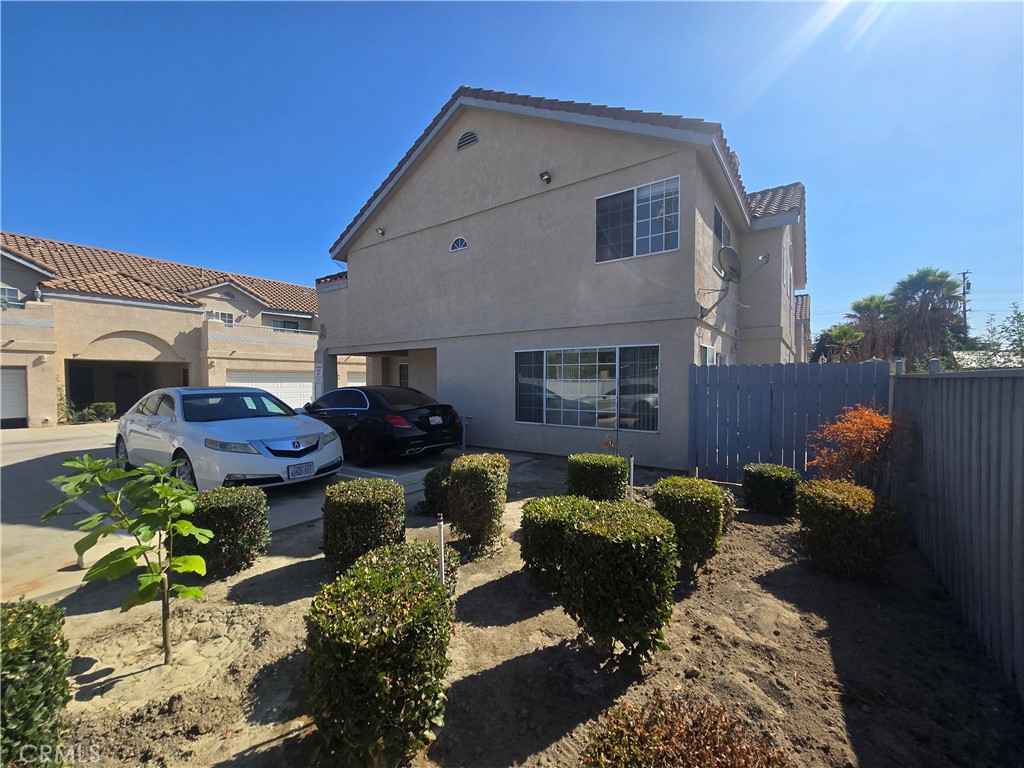 This exceptional end-unit townhome, ideally situated within a small, tranquil, gated community, presents a remarkable opportunity. Boasting 1366 square feet of spacious living area, this lovely home features three bedrooms and two and a half bathrooms, along with an attached two-car garage, a charming small patio, and a generously sized balcony. You are sure to appreciate the well-designed floor plan, which allows for an abundance of natural light throughout the home. The living room, dining area, kitchen, half-bath, and attached two-car garage are all conveniently located on the first floor. The kitchen has been tastefully upgraded with brand new granite countertops, a new sink and faucet, a new subway-style backsplash, recessed lighting, and beautiful new scratch and water-resistant LVP flooring throughout the house. Beautifully upgraded stairs lead to all three bedrooms and two bathrooms, including a gorgeous en-suite bathroom with a double sink, walk-in closet, a bathtub, a toilet with a separate enclosure for added privacy, and, of course, a fireplace. One of the bedrooms features a sliding door that opens to a huge balcony. A cute little patio provides a perfect space for relaxation or weekend barbecues. The entire home has been freshly painted. Additional amenities include a stainless-steel range, a dishwasher, a microwave, central air conditioning, hookups for a washer and dryer inside the garage, and a new garage door. Its convenient proximity to major freeways, shopping and entertainment centers, restaurants, and walking distance to Bellflower Middle & High School makes this an ideal location. Additional parking is available for guests. With one of the lowest HOA fees, this is an opportunity you certainly won't want to miss.