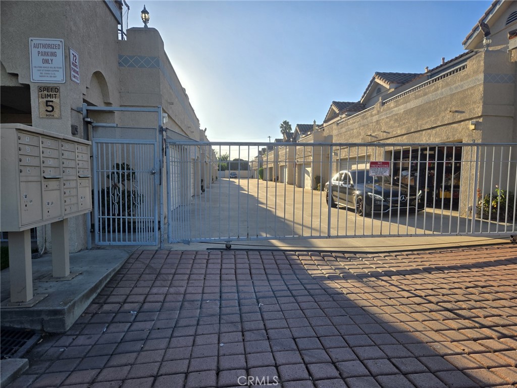 This exceptional end-unit townhome, ideally situated within a small, tranquil, gated community, presents a remarkable opportunity. Boasting 1366 square feet of spacious living area, this lovely home features three bedrooms and two and a half bathrooms, along with an attached two-car garage, a charming small patio, and a generously sized balcony. You are sure to appreciate the well-designed floor plan, which allows for an abundance of natural light throughout the home. The living room, dining area, kitchen, half-bath, and attached two-car garage are all conveniently located on the first floor. The kitchen has been tastefully upgraded with brand new granite countertops, a new sink and faucet, a new subway-style backsplash, recessed lighting, and beautiful new scratch and water-resistant LVP flooring throughout the house. Beautifully upgraded stairs lead to all three bedrooms and two bathrooms, including a gorgeous en-suite bathroom with a double sink, walk-in closet, a bathtub, a toilet with a separate enclosure for added privacy, and, of course, a fireplace. One of the bedrooms features a sliding door that opens to a huge balcony. A cute little patio provides a perfect space for relaxation or weekend barbecues. The entire home has been freshly painted. Additional amenities include a stainless-steel range, a dishwasher, a microwave, central air conditioning, hookups for a washer and dryer inside the garage, and a new garage door. Its convenient proximity to major freeways, shopping and entertainment centers, restaurants, and walking distance to Bellflower Middle & High School makes this an ideal location. Additional parking is available for guests. With one of the lowest HOA fees, this is an opportunity you certainly won't want to miss.