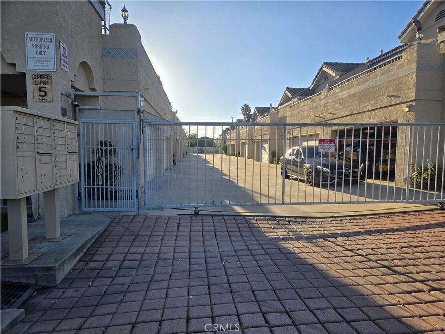 This exceptional end-unit townhome, ideally situated within a small, tranquil, gated community, presents a remarkable opportunity. Boasting 1366 square feet of spacious living area, this lovely home features three bedrooms and two and a half bathrooms, along with an attached two-car garage, a charming small patio, and a generously sized balcony. You are sure to appreciate the well-designed floor plan, which allows for an abundance of natural light throughout the home. The living room, dining area, kitchen, half-bath, and attached two-car garage are all conveniently located on the first floor. The kitchen has been tastefully upgraded with brand new granite countertops, a new sink and faucet, a new subway-style backsplash, recessed lighting, and beautiful new scratch and water-resistant LVP flooring throughout the house. Beautifully upgraded stairs lead to all three bedrooms and two bathrooms, including a gorgeous en-suite bathroom with a double sink, walk-in closet, a bathtub, a toilet with a separate enclosure for added privacy, and, of course, a fireplace. One of the bedrooms features a sliding door that opens to a huge balcony. A cute little patio provides a perfect space for relaxation or weekend barbecues. The entire home has been freshly painted. Additional amenities include a stainless-steel range, a dishwasher, a microwave, central air conditioning, hookups for a washer and dryer inside the garage, and a new garage door. Its convenient proximity to major freeways, shopping and entertainment centers, restaurants, and walking distance to Bellflower Middle & High School makes this an ideal location. Additional parking is available for guests. With one of the lowest HOA fees, this is an opportunity you certainly won't want to miss.