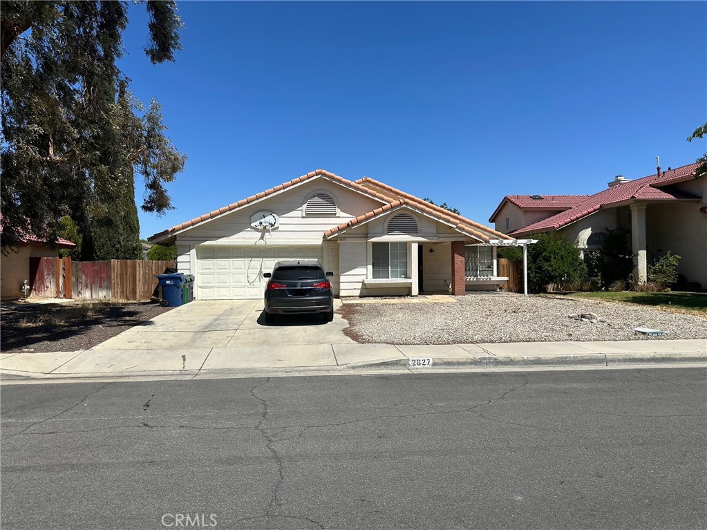 Welcome to this inviting single-story home in a desirable Palmdale neighborhood! Featuring 3 bedrooms and 2 bathrooms, this residence offers approximately 1,680 sq. ft. of comfortable living space on a generous 7,473 sq. ft. lot. The open floor plan is highlighted by a spacious family room with a cozy fireplace, perfect for relaxing or entertaining. A versatile game/office room provides the option for a 4th bedroom. The home includes a tile roof, central HVAC system, and a 2-car garage with an automatic opener. Step outside to enjoy a large backyard with a covered patio, ideal for gatherings and outdoor living. A side-yard storage shed adds convenience. Located near shopping centers with easy access to the 14 Freeway, this property combines comfort and convenience. Don’t miss out schedule your showing today!