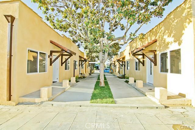 Discover a serene retreat in these beautifully remodeled courtyard bungalows in a garden-style setting. Each unit features a modern kitchen with granite countertops, updated bathrooms, durable laminate wood flooring, and energy-efficient dual-pane vinyl windows. These homes are enhanced with newer electrical systems and blend timeless charm with contemporary convenience. Don't miss the chance to experience this oasis in person and see for yourself!