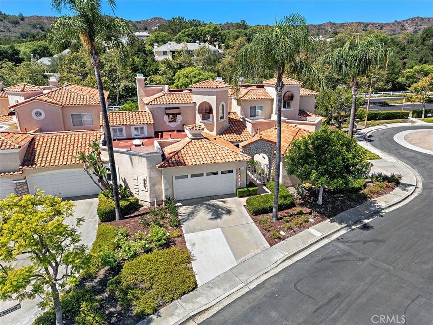 MAIN FLOOR MASTER: Welcome to 15 Via Barcaza, an elegantly upgraded residence in the highly desirable Los Verdes enclave of Coto de Caza. This beautifully maintained home offers 3 bedrooms, 2.5 bathrooms, and 2,102 square feet of thoughtfully designed living space. The main level features a luxurious primary suite with a spa-inspired bathroom showcasing a soaking tub, walk-in shower, and dual vanities. A unique no-step-down open floor plan seamlessly connects the family room, dining area, and upgraded kitchen, creating the perfect space for gatherings. The kitchen is enhanced with granite countertops, stainless steel appliances, bar seating, and a charming breakfast nook. High ceilings, skylights, and newer Milgard high-efficiency windows (with transferable warranty) flood the home with natural light. Upgrades include travertine tile flooring, crown molding, plantation shutters, French doors with mini blinds, and upgraded baseboards throughout. A cozy fireplace adds warmth to the inviting family room, while an awning off the patio keeps the home bright yet comfortable year-round. The backyard is a true highlight—featuring a newly remodeled patio, ample space for entertaining, a fenced-in area for pets, and room for grilling or gardening. Upstairs, two spacious secondary bedrooms share a remodeled bathroom and open to a balcony with hillside and sunset views. Practical updates add peace of mind, including a newer water heater (with warranty), newer PEX repipe (with warranty), and an attached two-car garage with built-in storage and laundry area. Set in the guard-gated community of Coto de Caza, this home offers both privacy and convenience. Residents enjoy access to miles of trails, parks, and the nearby Coto de Caza Golf & Racquet Club, featuring two Robert Trent Jones Jr. championship courses. Exclusive membership opportunities are available for golf, pickleball & tennis, fitness, swimming, and social amenities, offering a true resort-style living experience. 15 Via Barcaza is more than a home —it’s a lifestyle of comfort, elegance, and endless opportunity for entertaining and relaxation.
