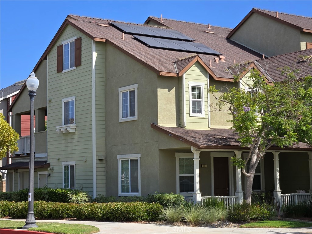 (Check back for more pictures soon). Beautifully priced and ready to be yours! Bring your EV - One of the very few units with owned solar and a battery backup! This charming tri-level end-unit condo welcomes you with serene park views right from your front porch. Nestled in the heart of Oxnard's vibrant and highly coveted Riverpark neighborhood, this home effortlessly blends comfort, style, and everyday convenience. Step inside to the light & bright open-concept living space—perfect for relaxing or gathering with loved ones. The inviting kitchen is the focal point of the downstairs, highlighted by rich granite countertops, sleek stainless steel appliances, and a generously sized center island. Retreat upstairs to your private sanctuary—the primary bedroom with its own soothing en-suite bathroom. Thoughtful touches include an oversized attached 2-car side-by-side garage with extra storage and direct access to your home, ample guest parking, convenient in-unit laundry, and direct access to Riverpark's exceptional amenities, including a dog park, walking trails, vibrant shops, delightful restaurants, lush parks, and the popular Collection at Riverpark is just steps away. This is more than a home; it’s a lifestyle waiting for you to embrace. Don't miss your chance to live in one of Oxnard’s most desirable communities.