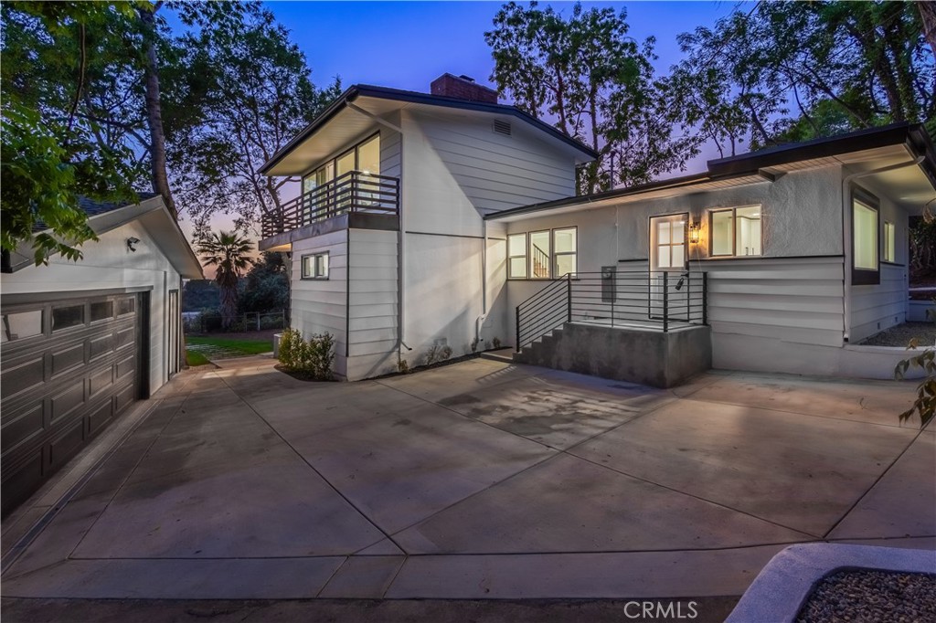 Extra Large Lot with views of downtown LA. 3 Bedrooms with 2 bathrooms on a multilevel home. Expansive lot with detached garage. Enjoy the views from your back yard or the balcony off the living room with incredible views of Downtown LA. Remodeled kitchen, Remodeled master bathroom, Remodeled hallway bathroom, New flooring, New baseboards, New windows, New driveway, New Garage Door, Separate Laundry room, Open concept with views to the backyard. Detached 2 car garage, Extra parking next to the garage. Mature trees on the lot. Fire pit at the end of the lot with opportunity to bake the smores and enjoy the relaxing view.