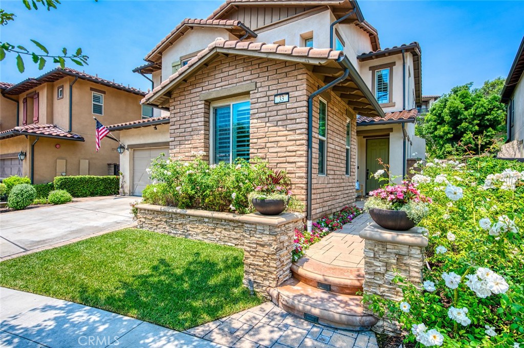 Nestled in the highly sought-after community of Rancho Mission Viejo, this meticulously maintained 4-bedroom, 3.5-bathroom home offers the perfect blend of comfort, functionality, and designer upgrades. Located in the charming Sendero neighborhood, this move-in ready residence features a flexible floor plan with a FULL DOWNSTAIRS EN-SUITE bedroom—ideal for guests or multigenerational living—plus a convenient powder room.
The open-concept main living area boasts a cozy fireplace in the family room, a spacious dining area, and a chef-inspired kitchen filled with natural light. Enjoy quartz countertops, a large center island, and all stainless steel appliances to include: built-in refrigerator, 6-burner cooktop, double ovens, wine refrigerator, dishwasher and microwave drawer, in addition to a convenient walk-in pantry. Double sliding doors lead to a lushly landscaped backyard featuring a covered patio and built-in firepit—perfect for relaxing, entertaining, or outdoor living.
Upstairs, you’ll find three additional bedrooms including a spacious primary suite filled with natural light and an oversized balcony. The luxurious primary bathroom includes dual vanities with quartz countertops, gorgeous textiles, a soaking tub, oversized beautiful walk-in shower, and a large walk-in closet. A full laundry room with sink is also located upstairs for added convenience.
Additional highlights include plantation shutters and crown molding throughout the home, dual-zone A/C, ceiling fans in every bedroom, PEX plumbing, new recessed lighting, full security alarm system and cameras, built-in surround sound (downstairs, primary bedroom, and backyard), and abundant storage throughout. The finished garage features epoxy floors, custom cabinets, ceiling-mounted storage racks, and upgraded garage door opener system with camera.
LOW HOA and LOW MELLO ROO TAX make this home even more desirable. Enjoy exclusive access to the incredible RMV amenities, including resort-style pools, splash pads, parks, clubhouses, fitness centers, hiking trails, putting greens, sport courts, tennis and pickleball courts, lagoons, and so much more... Turn the key and fall in love!