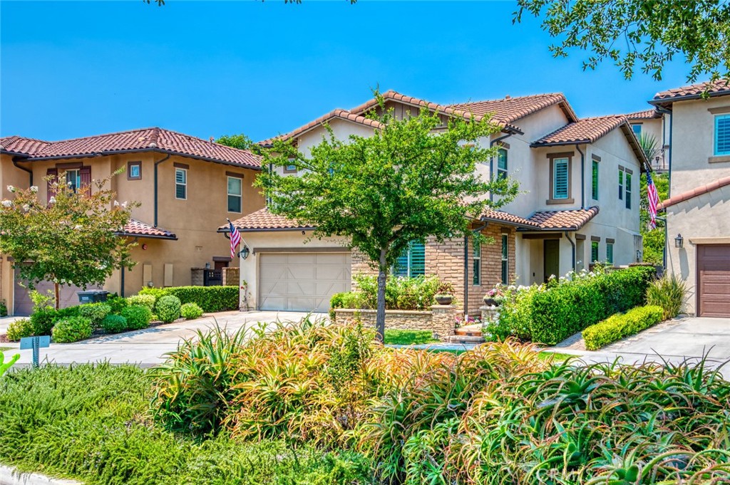 Nestled in the highly sought-after community of Rancho Mission Viejo, this meticulously maintained 4-bedroom, 3.5-bathroom home offers the perfect blend of comfort, functionality, and designer upgrades. Located in the charming Sendero neighborhood, this move-in ready residence features a flexible floor plan with a FULL DOWNSTAIRS EN-SUITE bedroom—ideal for guests or multigenerational living—plus a convenient powder room.
The open-concept main living area boasts a cozy fireplace in the family room, a spacious dining area, and a chef-inspired kitchen filled with natural light. Enjoy quartz countertops, a large center island, and all stainless steel appliances to include: built-in refrigerator, 6-burner cooktop, double ovens, wine refrigerator, dishwasher and microwave drawer, in addition to a convenient walk-in pantry. Double sliding doors lead to a lushly landscaped backyard featuring a covered patio and built-in firepit—perfect for relaxing, entertaining, or outdoor living.
Upstairs, you’ll find three additional bedrooms including a spacious primary suite filled with natural light and an oversized balcony. The luxurious primary bathroom includes dual vanities with quartz countertops, gorgeous textiles, a soaking tub, oversized beautiful walk-in shower, and a large walk-in closet. A full laundry room with sink is also located upstairs for added convenience.
Additional highlights include plantation shutters and crown molding throughout the home, dual-zone A/C, ceiling fans in every bedroom, PEX plumbing, new recessed lighting, full security alarm system and cameras, built-in surround sound (downstairs, primary bedroom, and backyard), and abundant storage throughout. The finished garage features epoxy floors, custom cabinets, ceiling-mounted storage racks, and upgraded garage door opener system with camera.
LOW HOA and LOW MELLO ROO TAX make this home even more desirable. Enjoy exclusive access to the incredible RMV amenities, including resort-style pools, splash pads, parks, clubhouses, fitness centers, hiking trails, putting greens, sport courts, tennis and pickleball courts, lagoons, and so much more... Turn the key and fall in love!