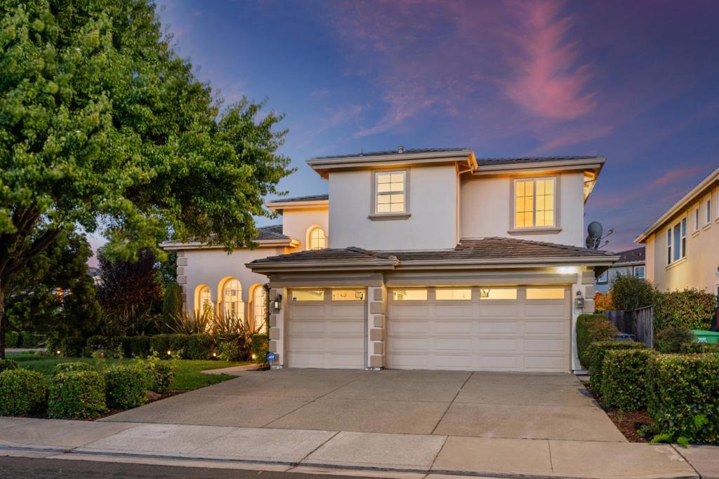 Beautiful corner-lot residence offers 5 BD, 4 BA, and a versatile office space right off staircase landing, perfectly blending elegance and comfort. Upon entry, you are welcomed by soaring cathedral ceilings and a graceful spiral staircase, creating a striking first impression. The gourmet kitchen is a chefs delight, featuring rich cherry wood cabinetry, granite countertops, a central island, built-in appliances, a gas cooktop, and a tasteful tiled backsplash designed for both functionality and timeless style. The light-filled living room is enhanced by a cozy corner fireplace, custom built-ins, and expansive windows that frame the space with warmth and charm. A thoughtful floor plan provides 1 bedroom and 1 full bath on the main level, while the upper level hosts four additional bedrooms, three baths. The luxurious primary suite boasts a generous walk-in closet, a spa-inspired soaking tub, a walk-in shower, and an oversized L-shaped vanity. A 3-car garage with ample storage completes this exceptional home. Ideally located near top-rated Delaine Eastin Elementary, and within walking distance to Alameda Creek and Coyote Hills, this home also offers convenient access to I-880/84/92, BART, Union Landing, and major bay area employers.