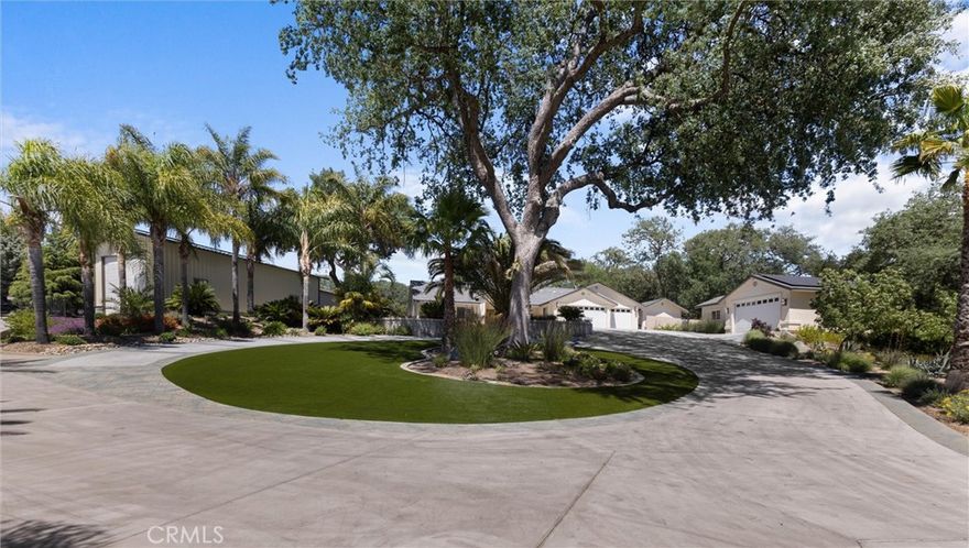 Welcome to this exquisite Atascadero estate! A masterfully designed property nestled among the scenic hills and majestic oak trees. Spanning nearly an acre, this residence offers unparalleled privacy and luxurious living, with over $300,000 invested in meticulous landscaping and sophisticated outdoor spaces.



The front yard is a grand introduction, featuring a circular driveway, stunning custom stamped and colored concrete, and a lush mix of manicured greenery, synthetic lawn, and vibrant flower beds with seasonal color rotations. Mature King and Queen palm trees, along with stately oaks, create a picturesque setting. Programmable landscape lighting adds a touch of elegance to an outdoor evening on the Central Coast.



The expansive backyard is an entertainer’s paradise. A covered patio with recessed lighting and skylights extends the length of the home, overlooking a beautiful PebbleTec saltwater pool with a slide, and oversized hot tub. The pool house is complete with a bathroom, shower, and mini-split cooling system. 



Inside, the home exudes sophistication with its open-concept layout, vaulted ceilings, and travertine floors throughout. The gourmet kitchen, boasting a $100,000 remodel, is a chef's dream with Thermador appliances,  a striking hammered-finish metal farmhouse sink. Custom black solid-maple cabinetry, a wrap-around breakfast bar, and a custom pantry with pull-out drawers complete this exceptional culinary space.



The primary suite is a true sanctuary, featuring a spacious bedroom with vaulted ceilings, a walk-in California closet, and a remodeled spa-like bathroom with an oversized Jacuzzi jet tub, leathered granite countertops, and matching tile throughout. Two additional bedrooms also feature California closets, while a fourth bedroom is equipped with extensive cabinets, and the office adds versatility.



Additional highlights include a 63-panel solar system powering the entire property, a three-car finished attached garage with custom cabinetry by Morro Bay  cabinets, a two-car detached garage with an office, two versatile sheds, and an RV barn measuring approximately 22 x 48 with hook-ups and extensive shelving ($150,000 build).



This remarkable Atascadero property offers an unmatched combination of luxury, privacy, and thoughtful design. Don’t miss your opportunity to experience it firsthand.